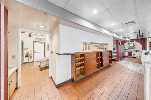 a lobby with glass door and glass windows