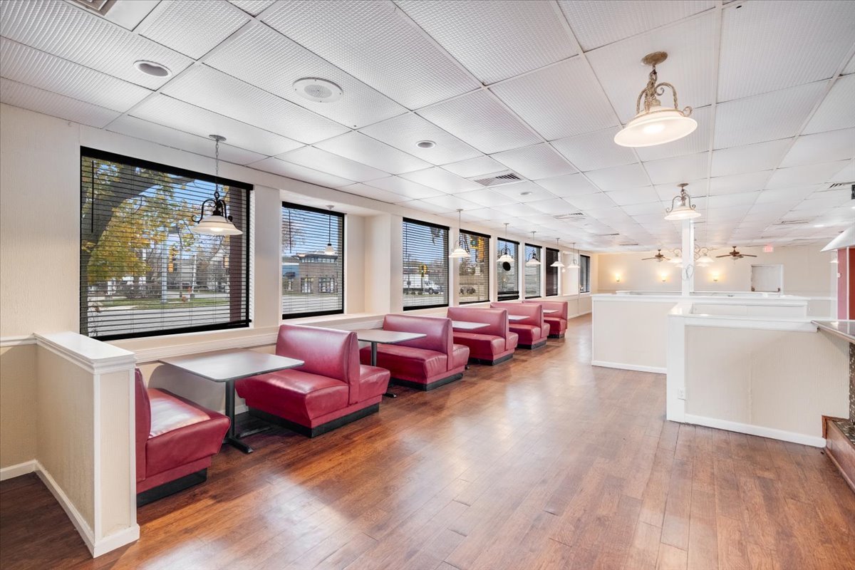 2312 West Springfield Avenue Champaign, IL 61821 - Photo 2 of 48 a living room with furniture kitchen view and a wooden floor