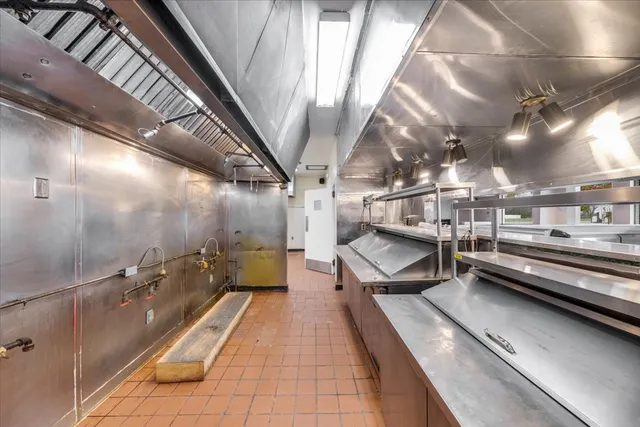 a bathroom with a tub and a shower