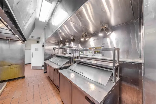 a bathroom with double vanity and a bathtub