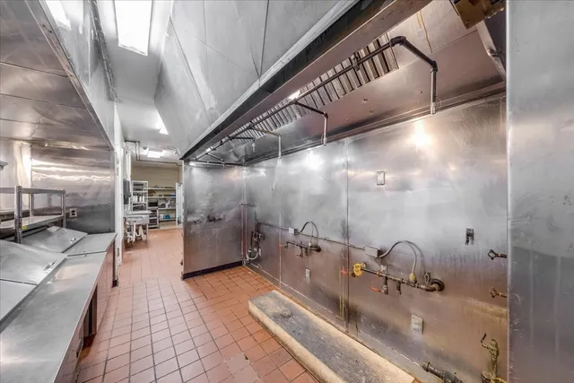 a kitchen with stainless steel appliances granite countertop lots of counter top space