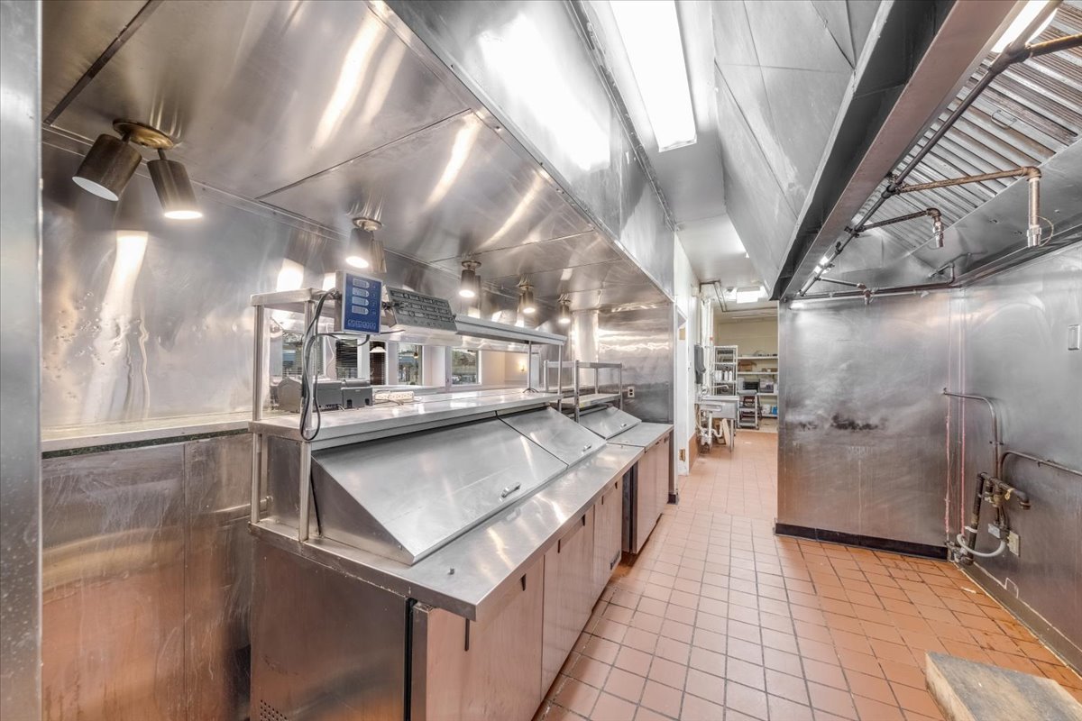 2312 West Springfield Avenue Champaign, IL 61821 - Photo 25 of 48 a kitchen with stainless steel appliances granite countertop lots of counter top space