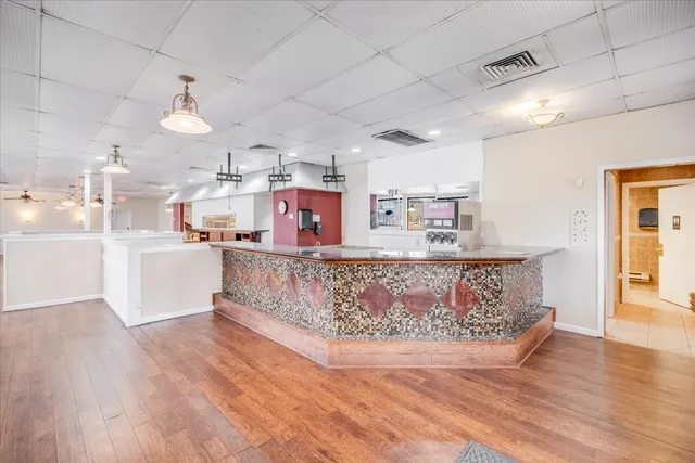 a large white kitchen with lots of counter space
