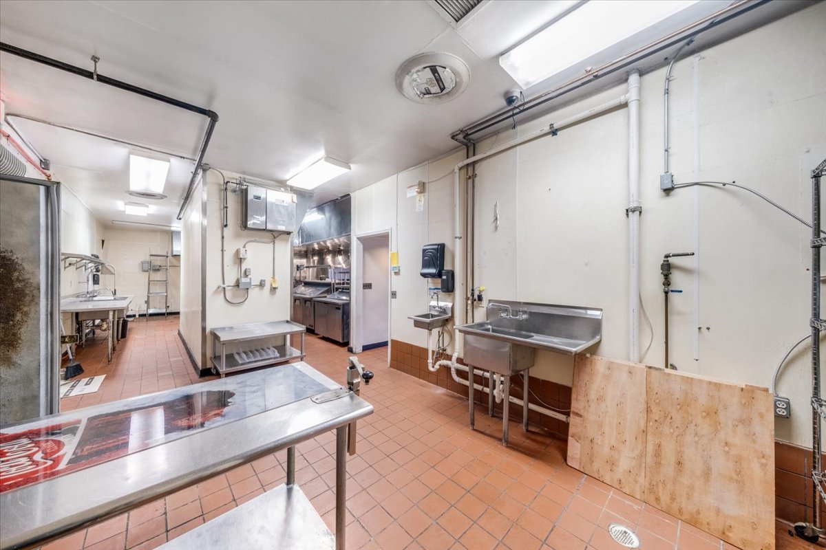 2312 West Springfield Avenue Champaign, IL 61821 - Photo 34 of 48 a room with stainless steel appliances kitchen island granite countertop furniture and a kitchen view