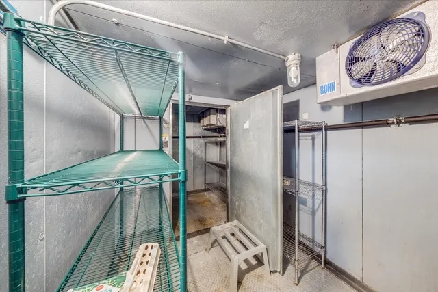 a living room with furniture a rug and a window