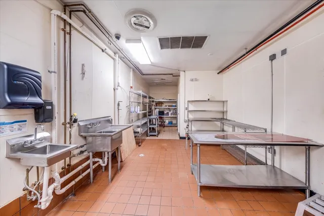 a view of an empty room and wooden floor