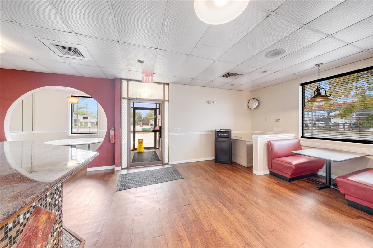 2312 West Springfield Avenue Champaign, IL 61821 - Photo 38 of 48 a living room with furniture a rug and a window