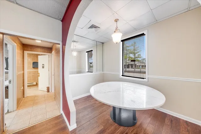 a view of a livingroom with furniture and staircase