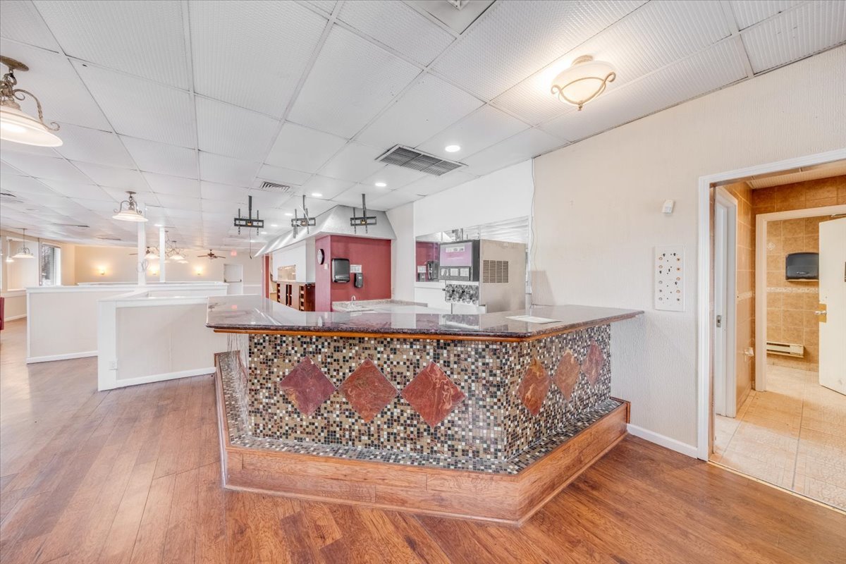 2312 West Springfield Avenue Champaign, IL 61821 - Photo 45 of 48 a living room with furniture and a wooden floor
