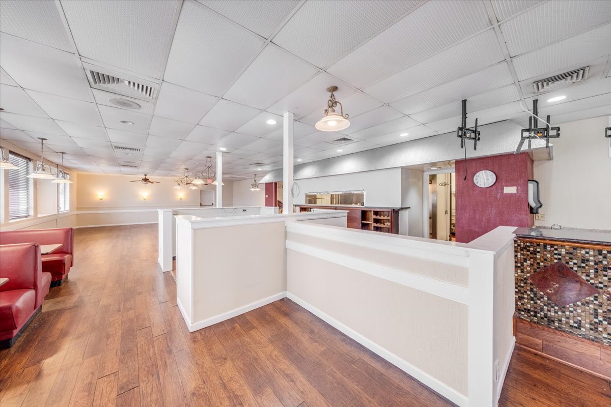 2312 West Springfield Avenue Champaign, IL 61821 - Photo 5 of 48 a view of a kitchen and a refrigerator in a living room