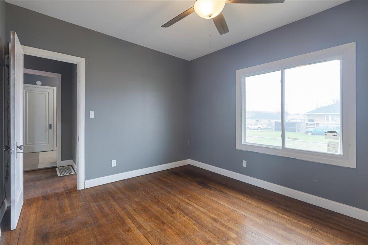 456 Bridge Street Gary, IN 46404 - Photo 12 of 27 a view of a room with wooden floor and a window