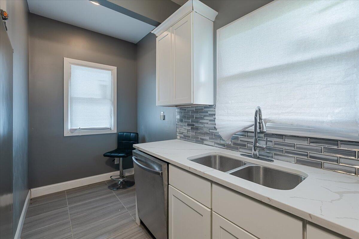 456 Bridge Street Gary, IN 46404 - Photo 20 of 27 a kitchen that has a sink and a stove