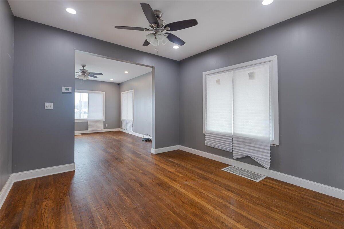 456 Bridge Street Gary, IN 46404 - Photo 10 of 27 wooden floor in an empty room with a window