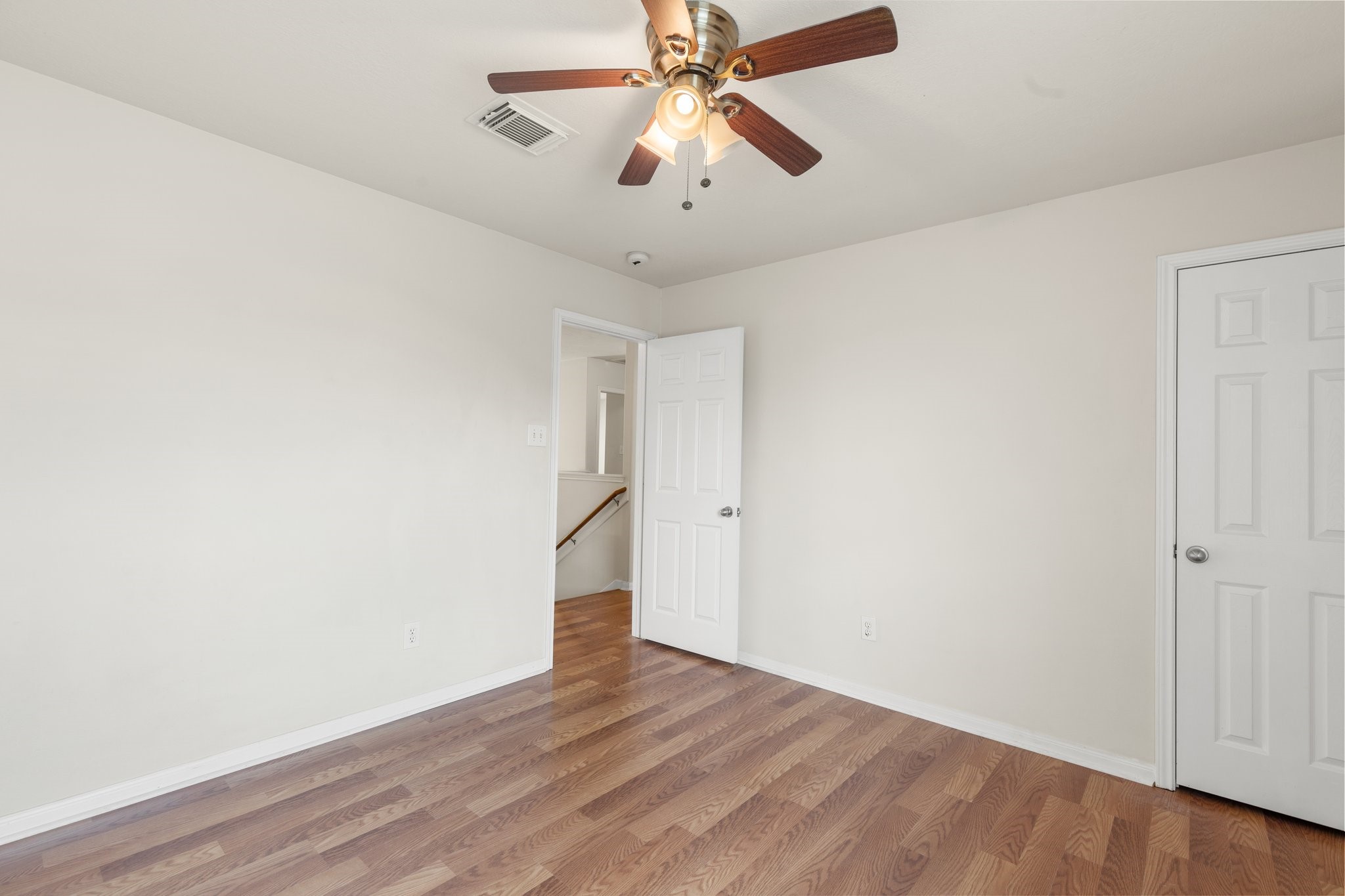 3111 Holly Ranch Drive Katy, TX 77494 - Photo 23 of 28 a view of empty room with wooden floor and fan