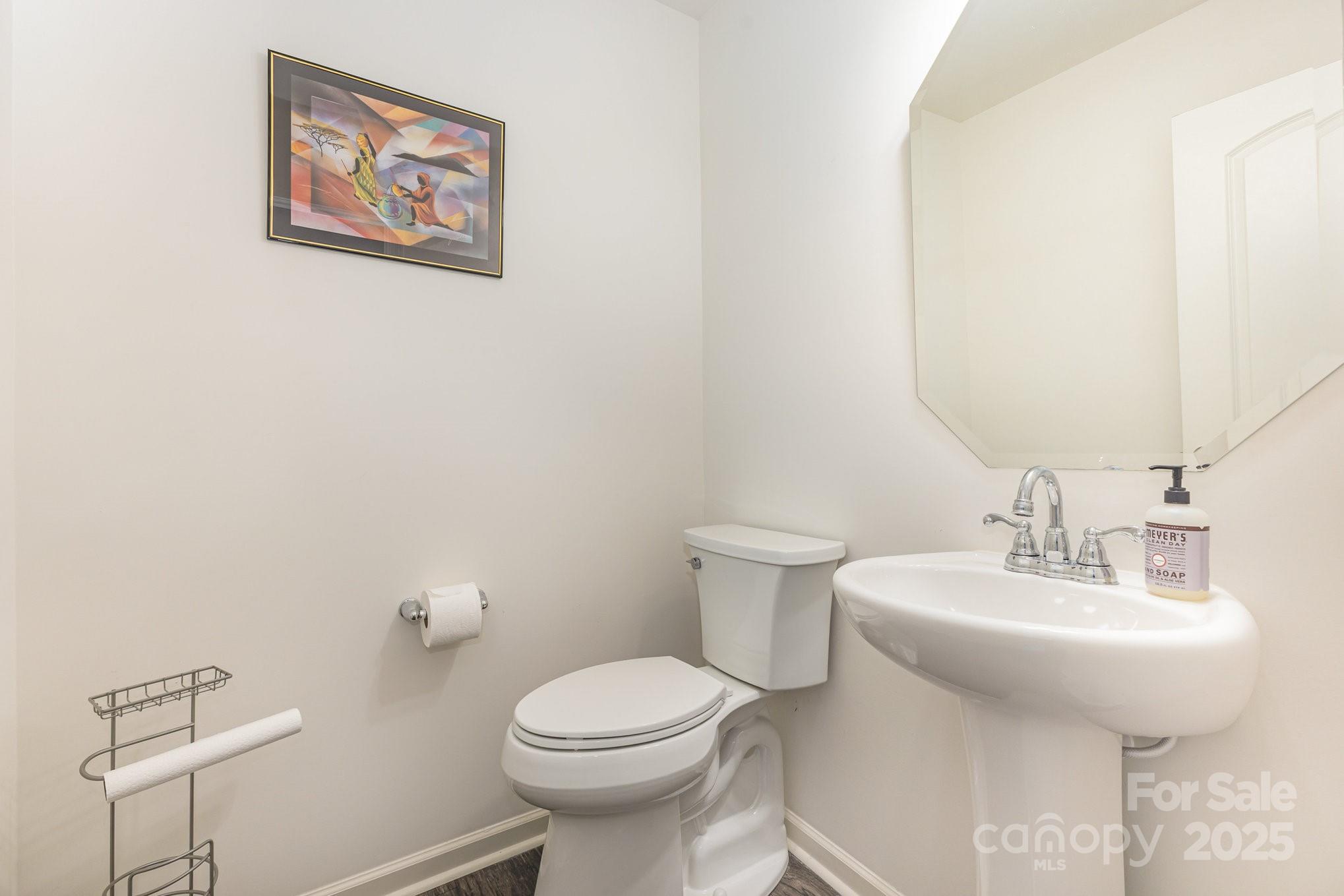 12926 Hill Pine Road Midland, NC 28107 - Photo 13 of 30 a bathroom with a sink mirror and toilet