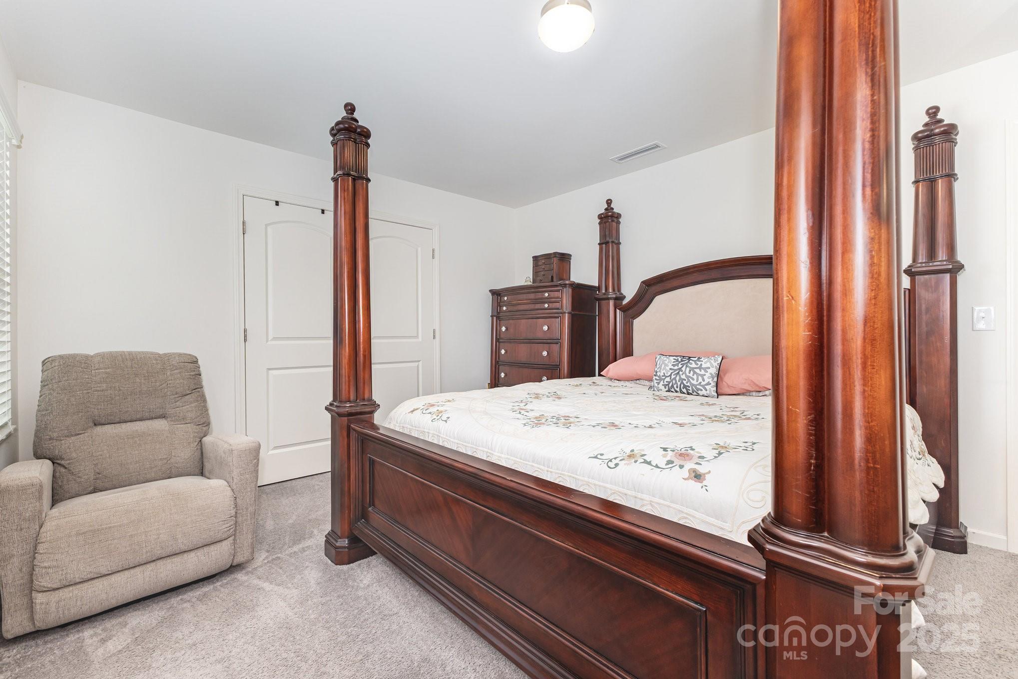 12926 Hill Pine Road Midland, NC 28107 - Photo 20 of 30 a bedroom with a bed and a couch
