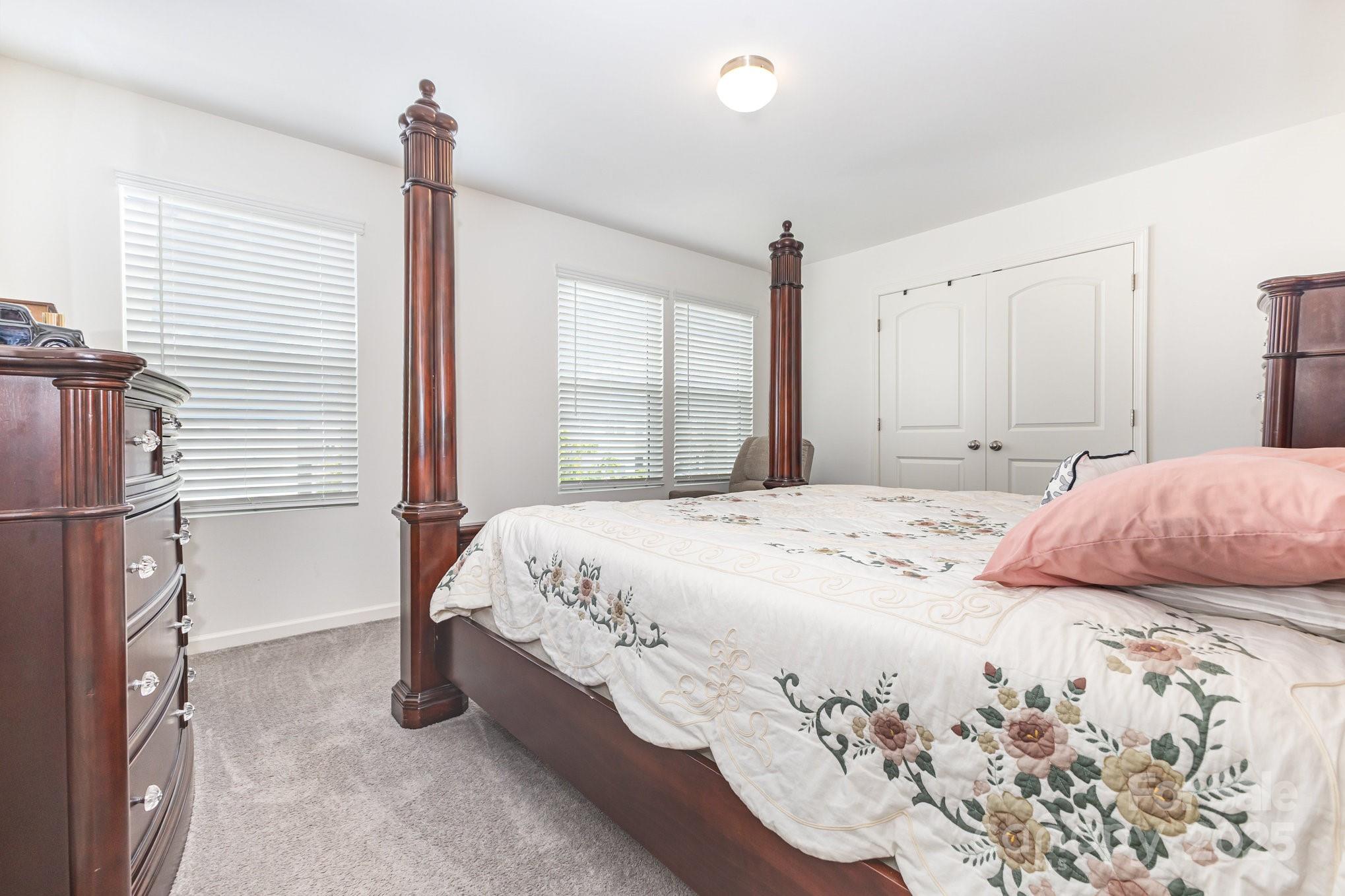 12926 Hill Pine Road Midland, NC 28107 - Photo 21 of 30 a bedroom with a bed and a window