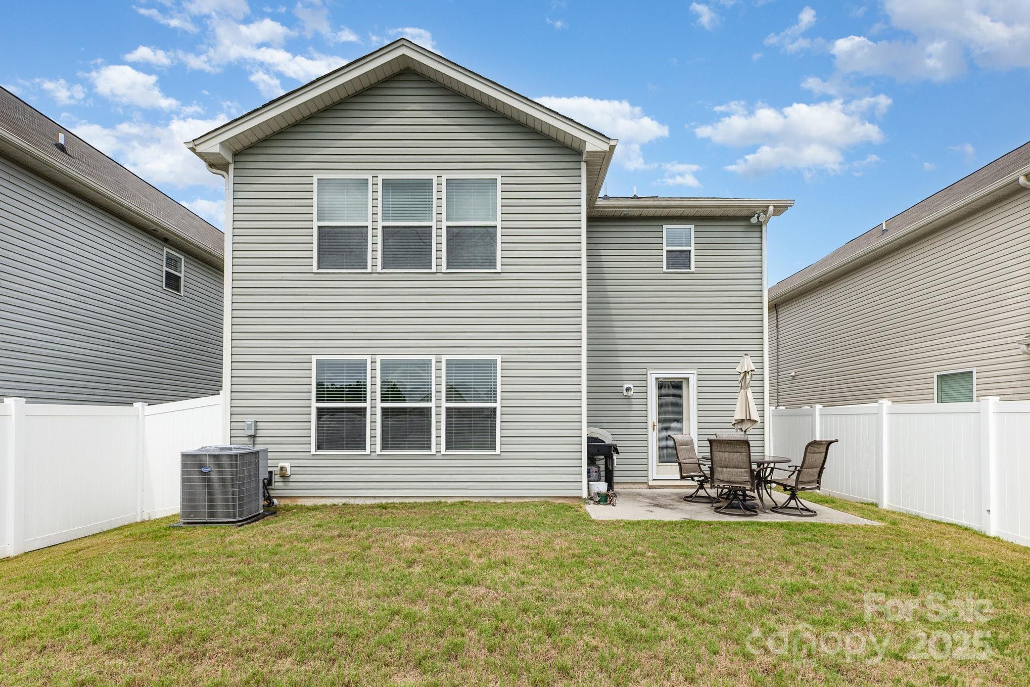 12926 Hill Pine Road Midland, NC 28107 - Photo 28 of 30 a view of a house with dining room and wooden fence