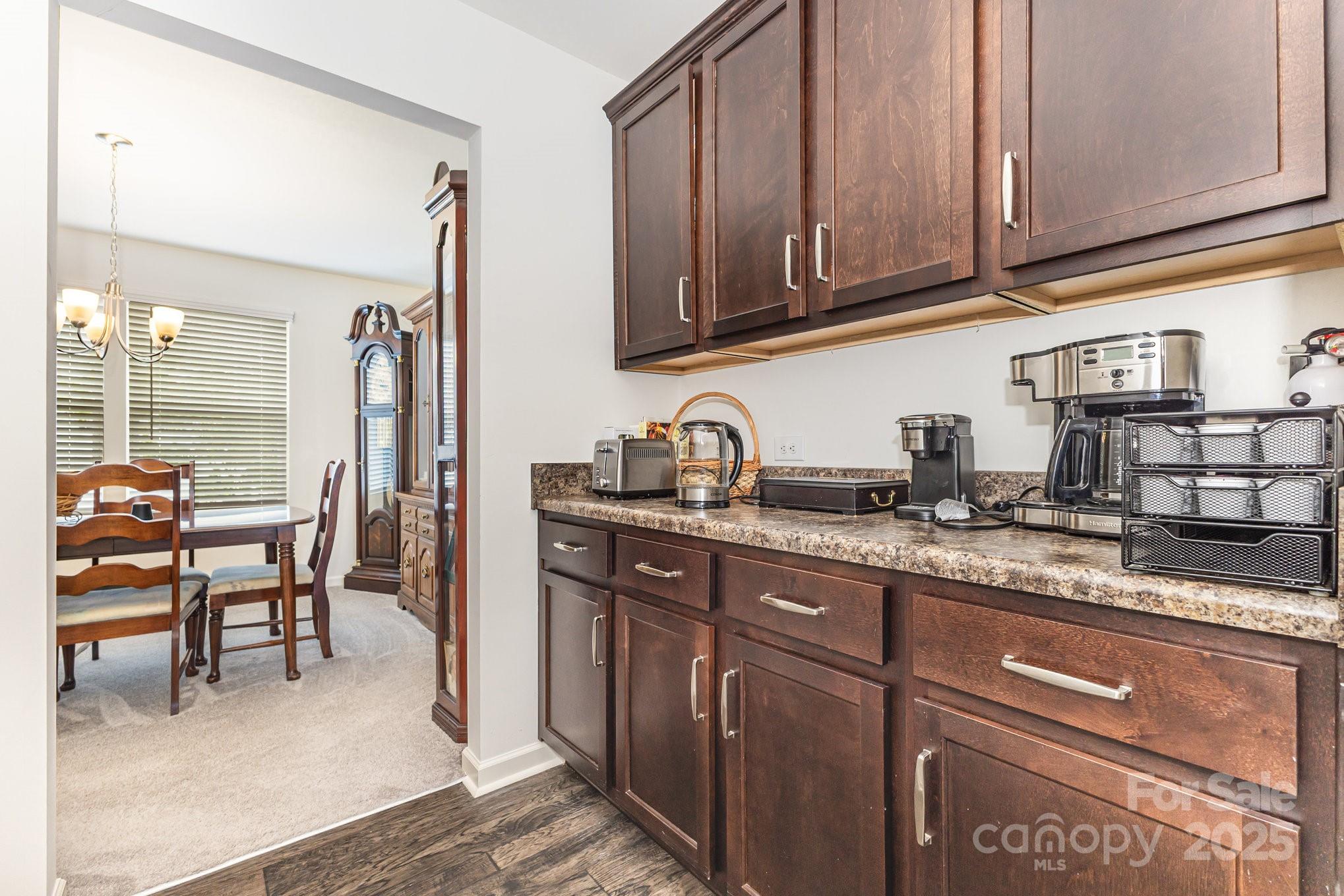 12926 Hill Pine Road Midland, NC 28107 - Photo 29 of 30 a kitchen with stainless steel appliances granite countertop a sink and cabinets