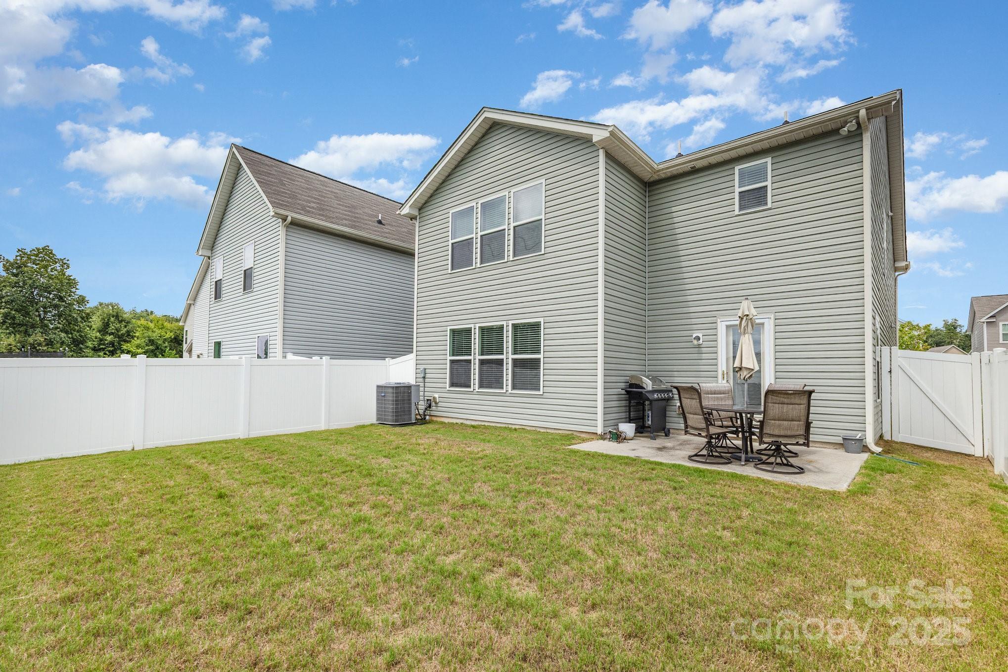 12926 Hill Pine Road Midland, NC 28107 - Photo 30 of 30 a backyard of a house with yard and outdoor seating