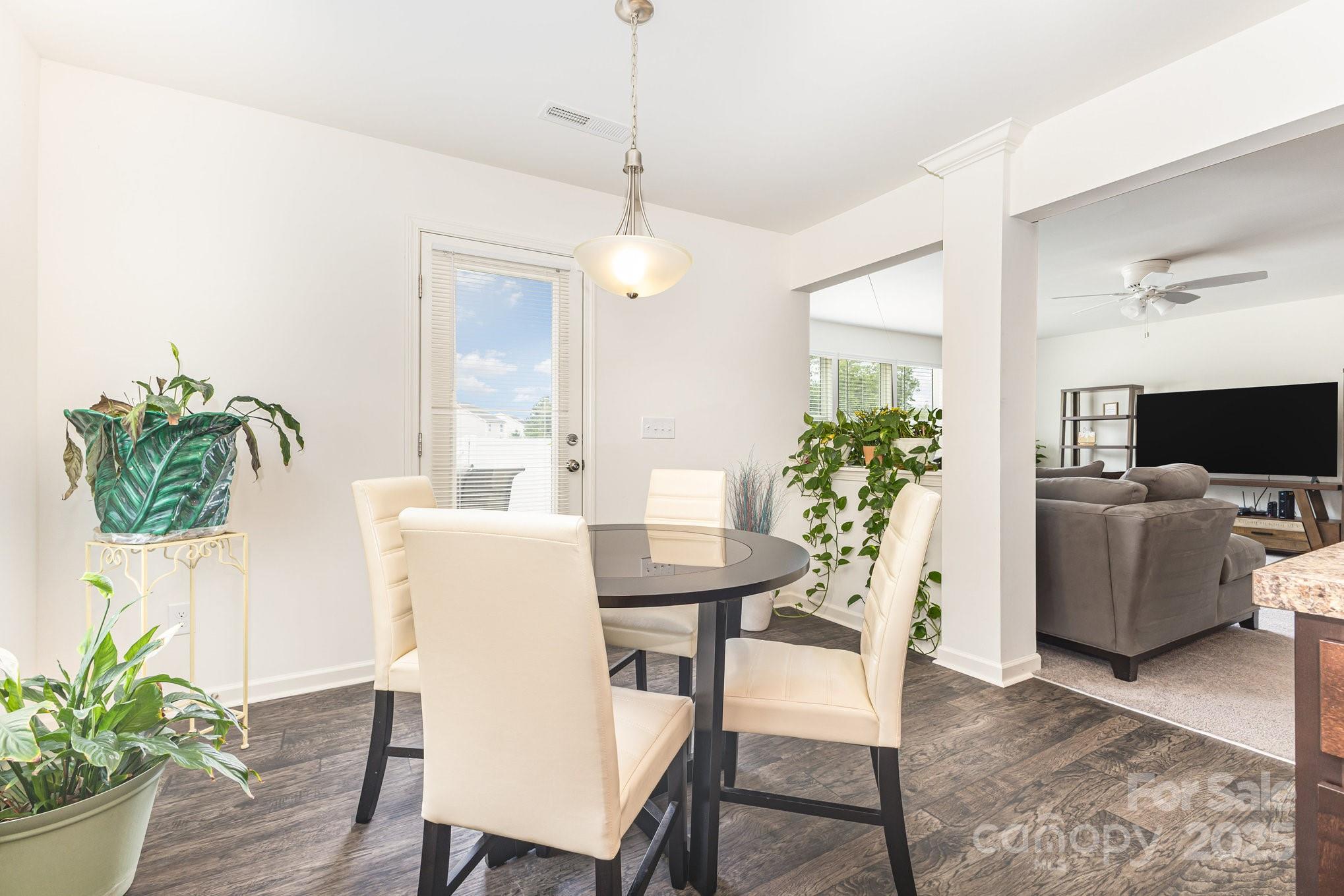 12926 Hill Pine Road Midland, NC 28107 - Photo 4 of 30 a dining room with furniture and wooden floor