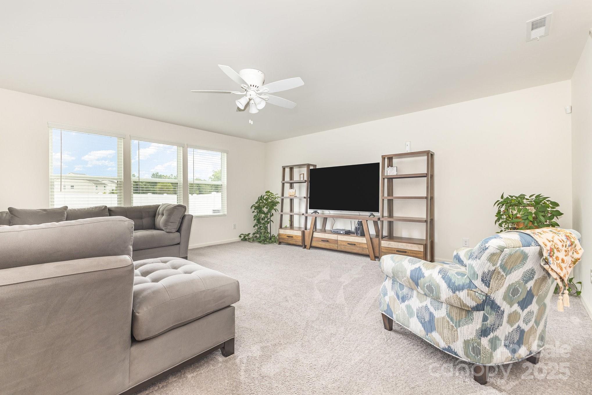 12926 Hill Pine Road Midland, NC 28107 - Photo 7 of 30 a living room with furniture and a flat screen tv