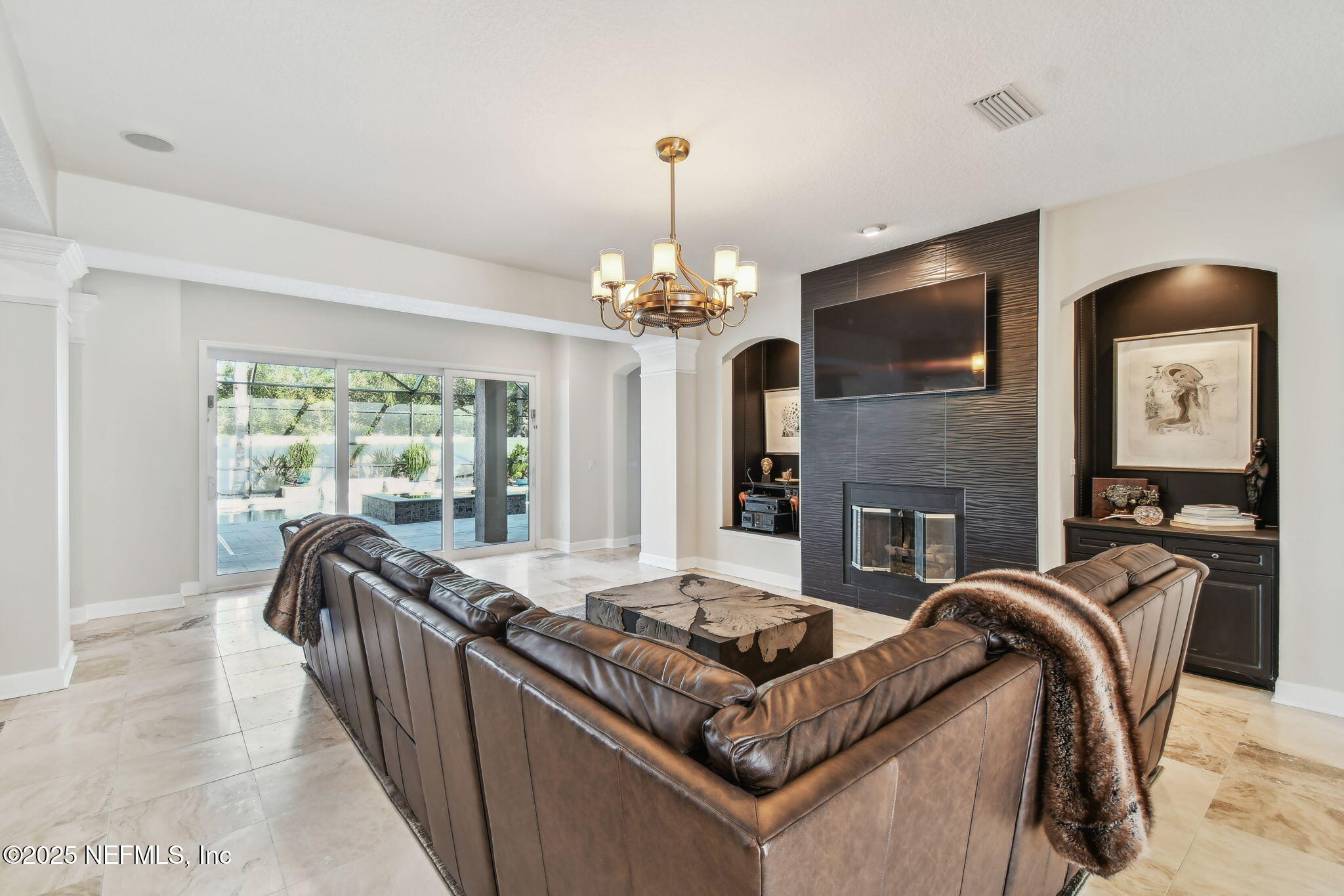 100 La Mesa Drive St. Augustine, FL 32095 - Photo 7 of 49 a living room with fireplace furniture and a flat screen tv