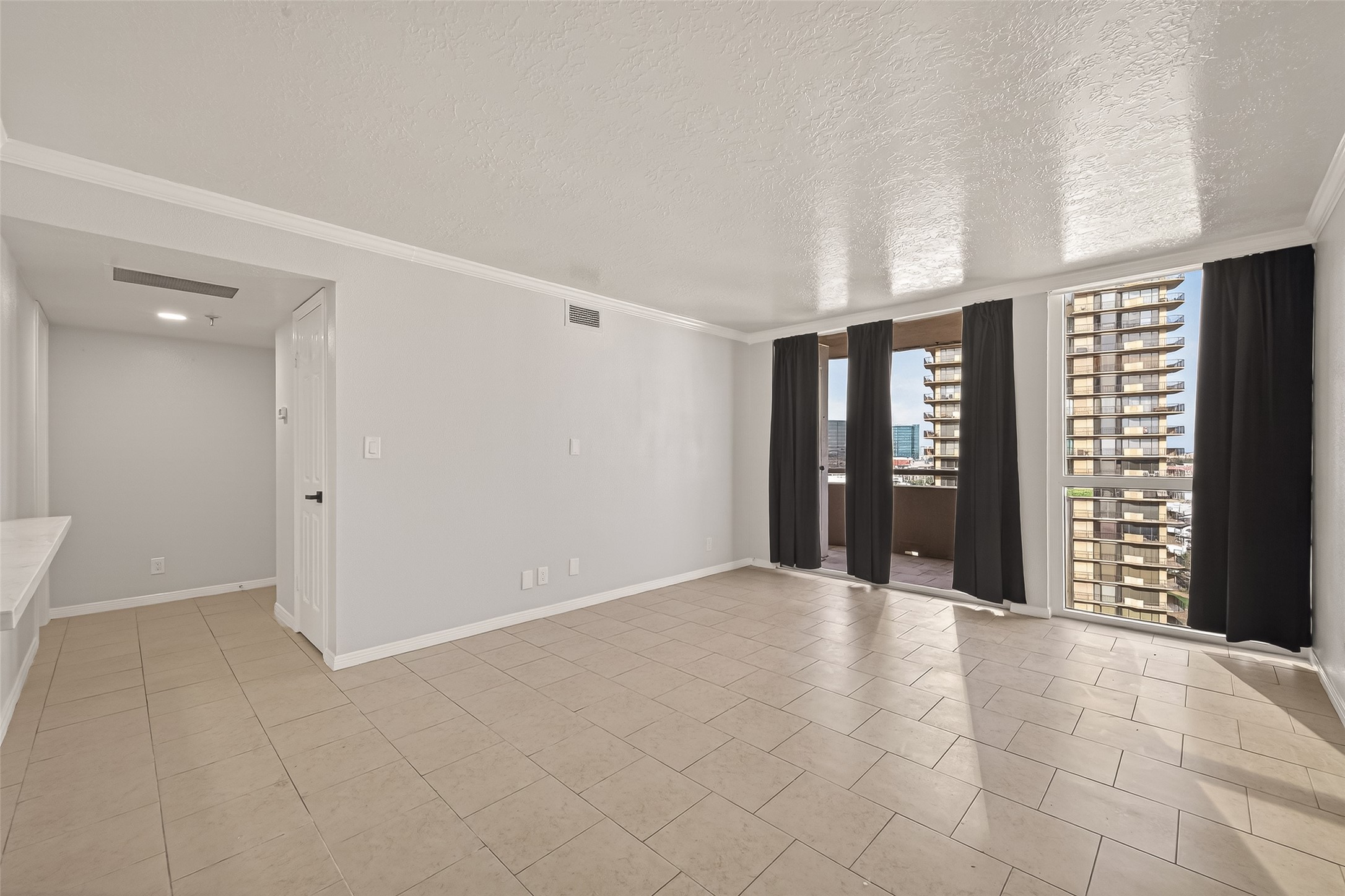 3525 Sage Road, Unit 1405 Houston, TX 77056 - Photo 13 of 37 wooden floor in an empty room with a window