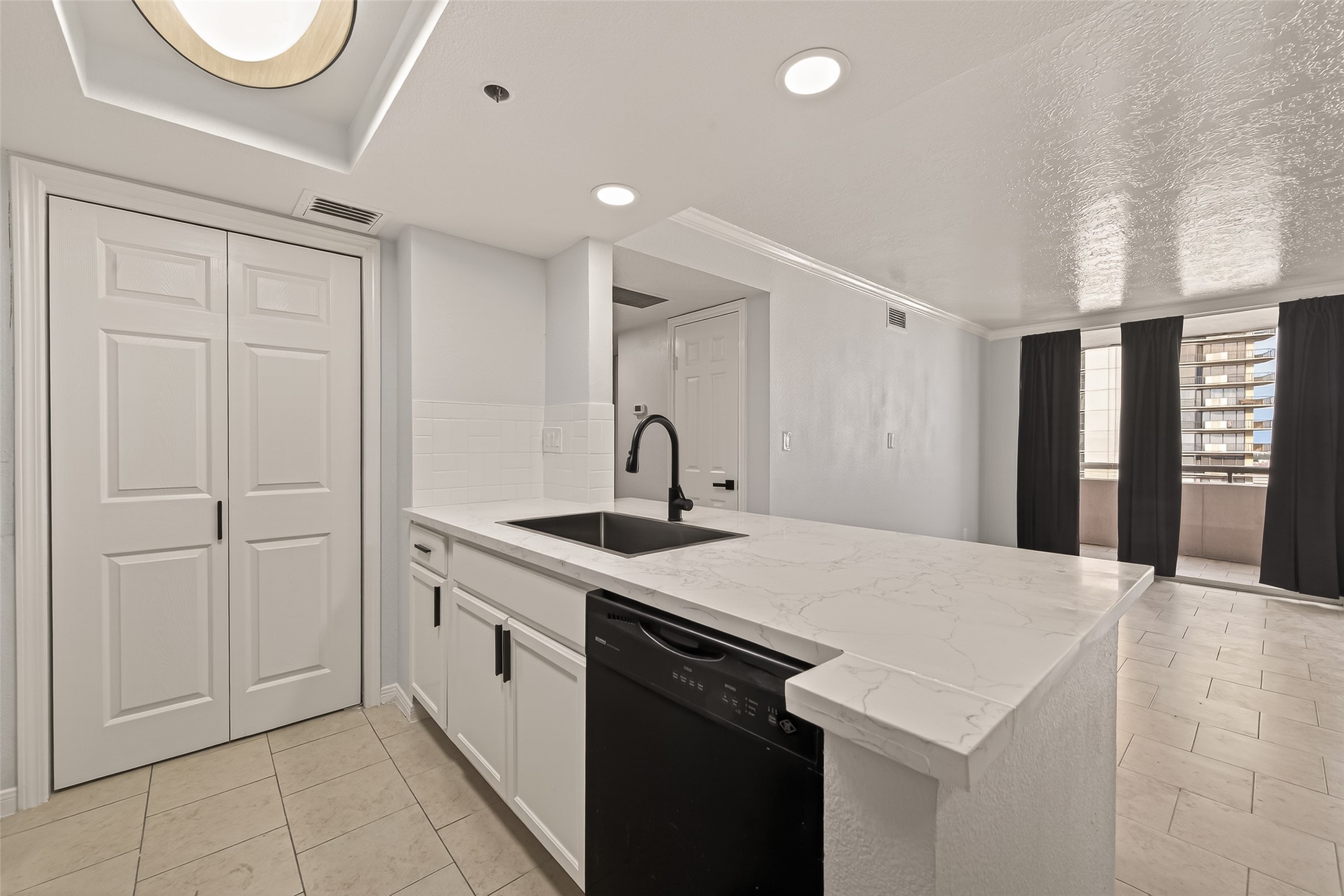 3525 Sage Road, Unit 1405 Houston, TX 77056 - Photo 15 of 37 a kitchen with a sink and a refrigerator