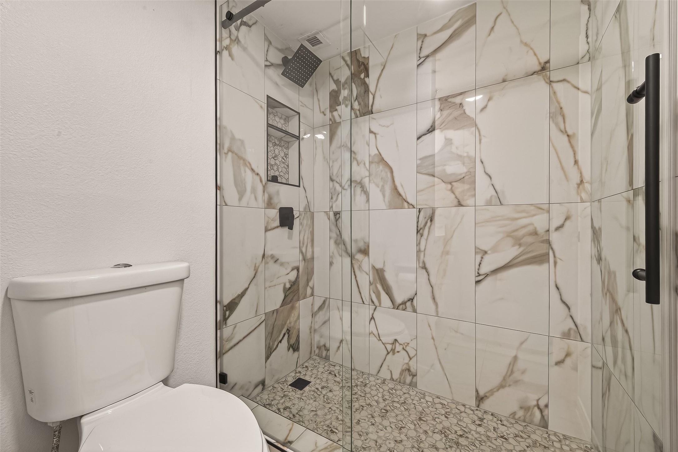 3525 Sage Road, Unit 1405 Houston, TX 77056 - Photo 25 of 37 a white toilet sitting next to a shower curtain