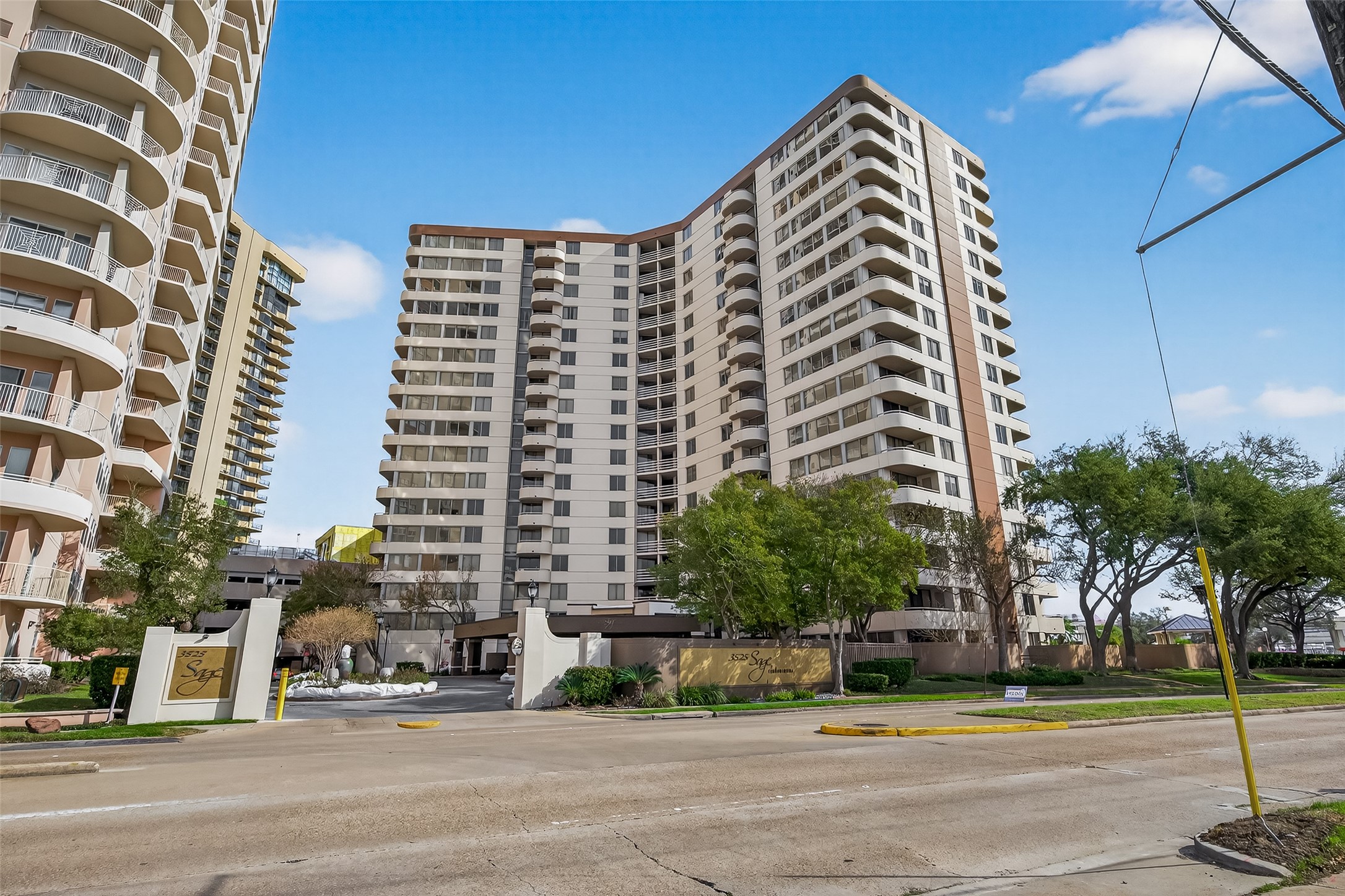 3525 Sage Road, Unit 1405 Houston, TX 77056 - Photo 5 of 37 a view of a tall building next to a road