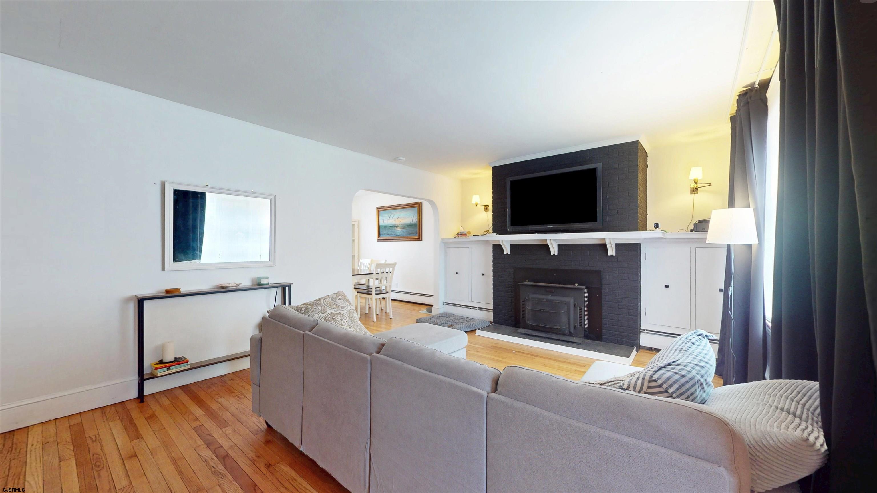 2300 Shore Road Linwood, NJ 08221 - Photo 12 of 50 a living room with furniture and a flat screen tv