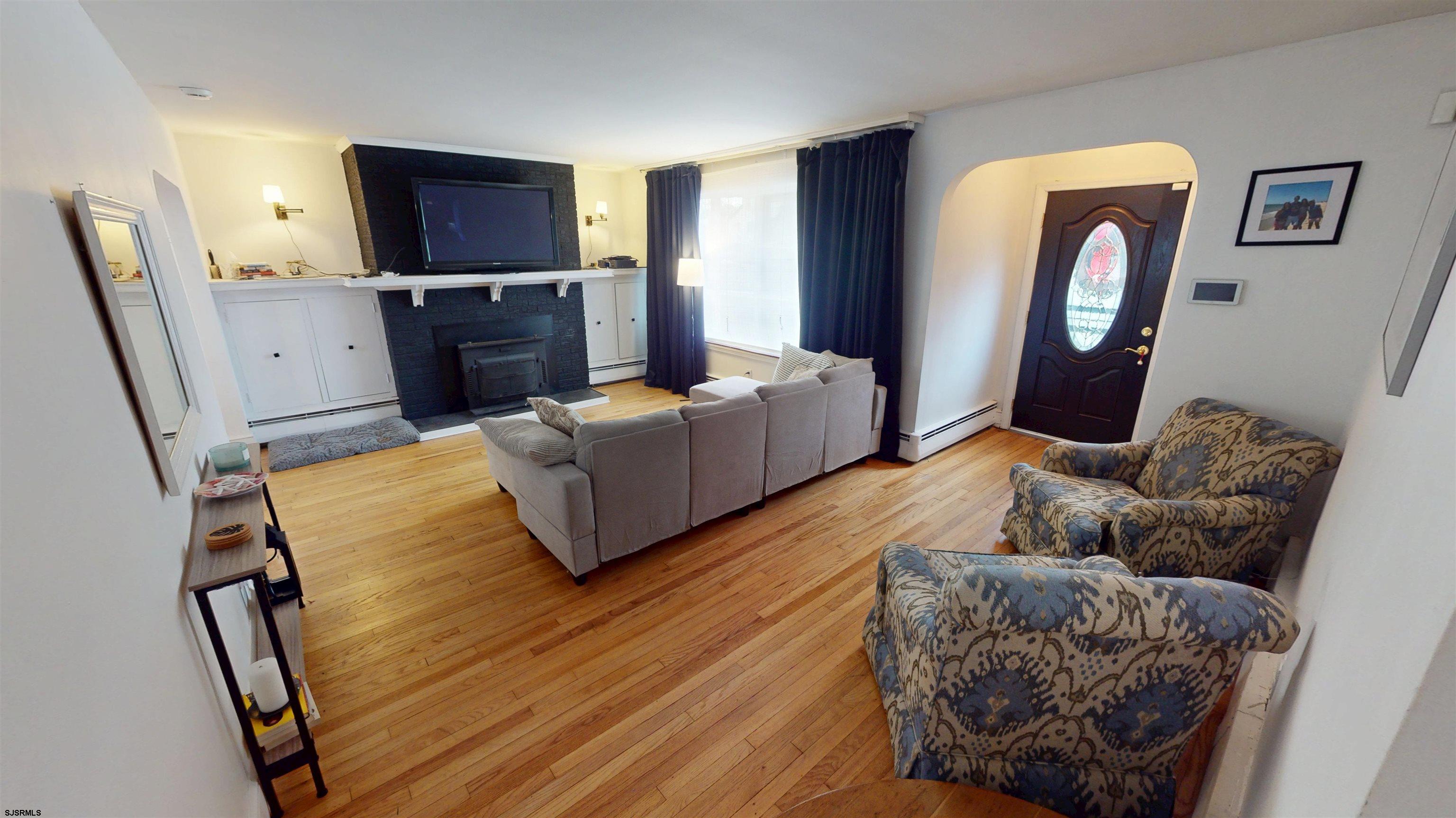 2300 Shore Road Linwood, NJ 08221 - Photo 16 of 50 a living room with furniture and a flat screen tv