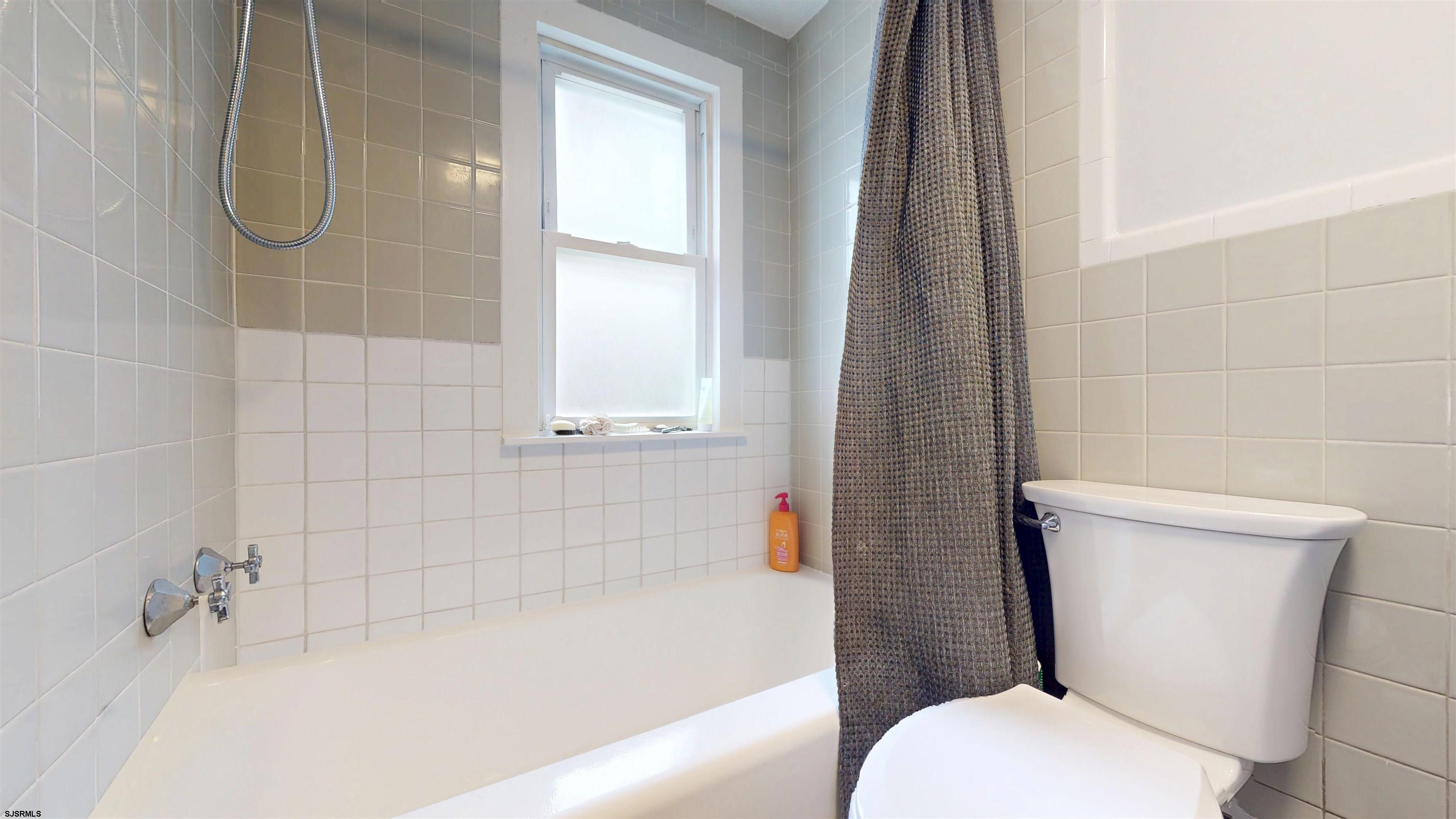 2300 Shore Road Linwood, NJ 08221 - Photo 17 of 50 a white toilet sitting next to a bath tub and shower