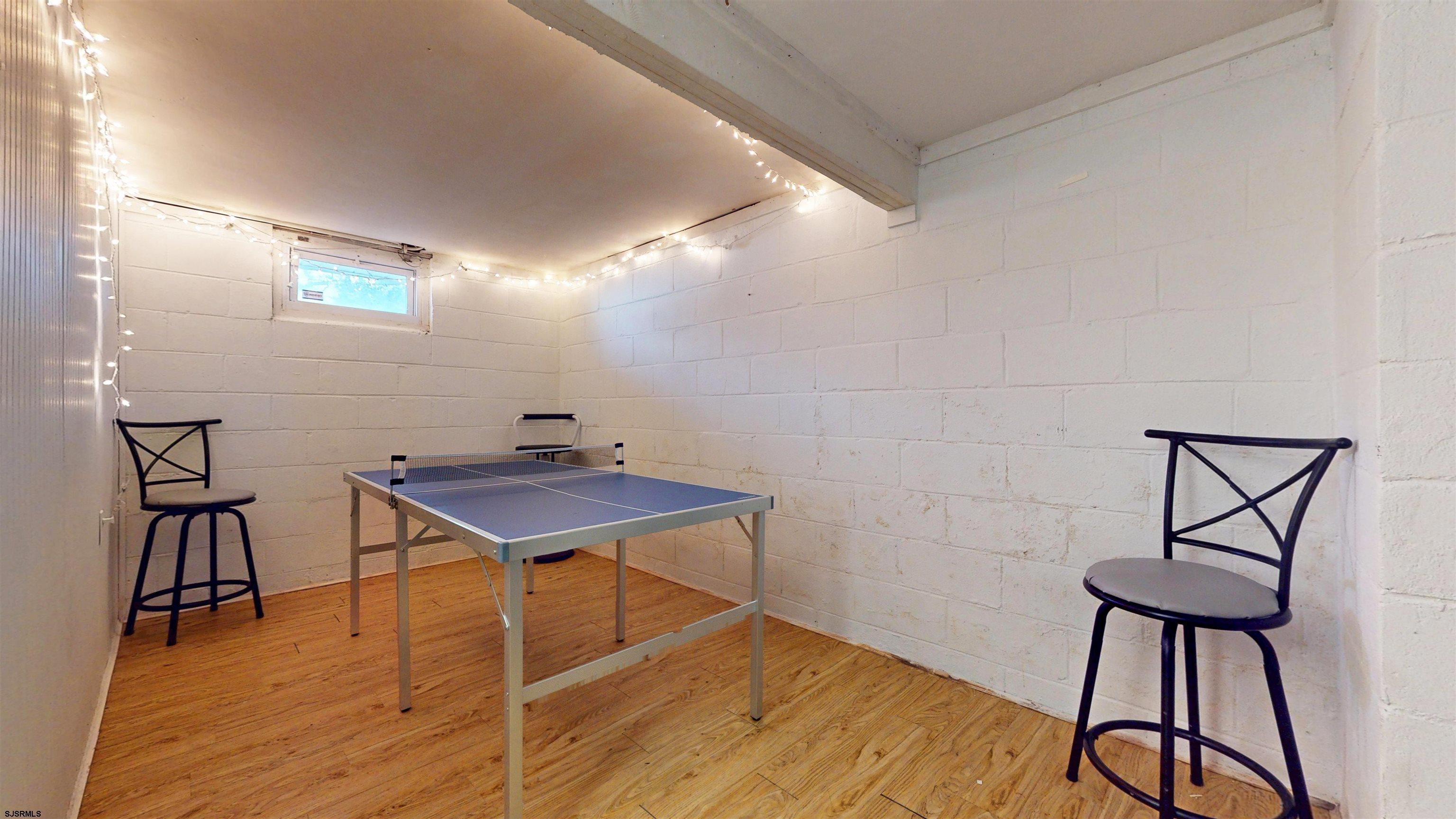 2300 Shore Road Linwood, NJ 08221 - Photo 18 of 50 a room with furniture and wooden floor