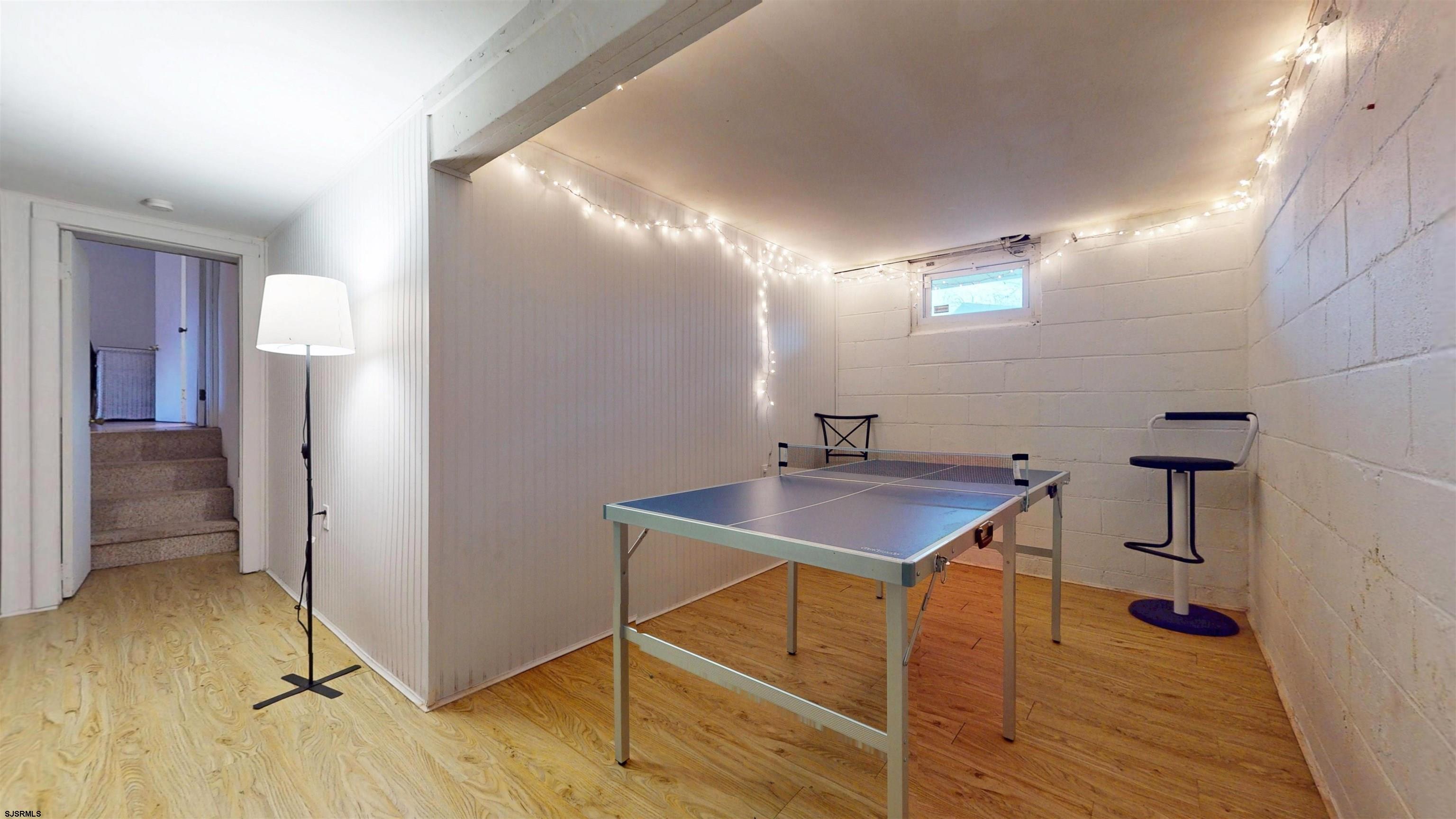 2300 Shore Road Linwood, NJ 08221 - Photo 19 of 50 a room with table chairs and wooden floor