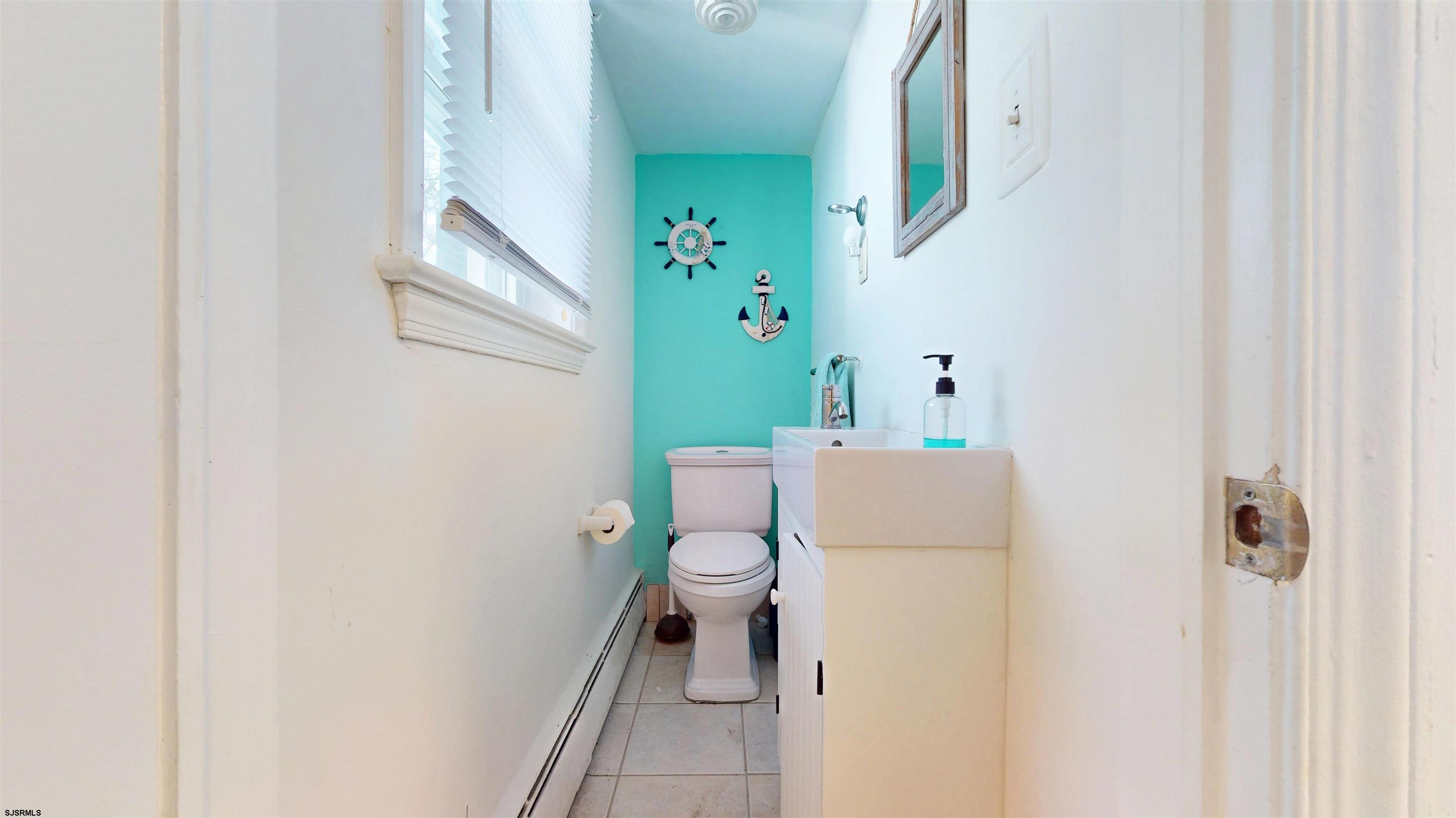 2300 Shore Road Linwood, NJ 08221 - Photo 2 of 50 a bathroom with a white toilet and a shower