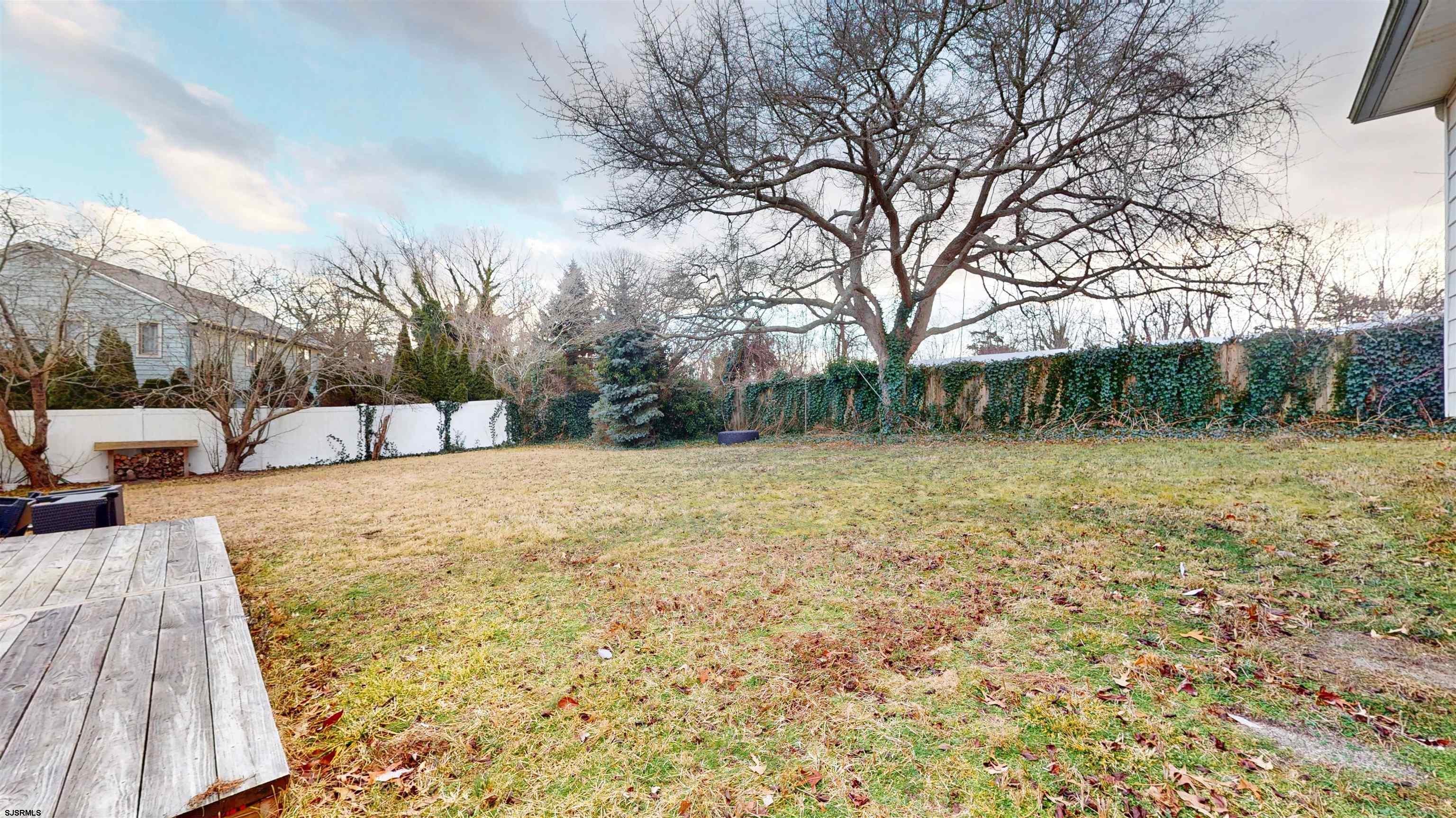 2300 Shore Road Linwood, NJ 08221 - Photo 22 of 50 a view of backyard with wooden fence