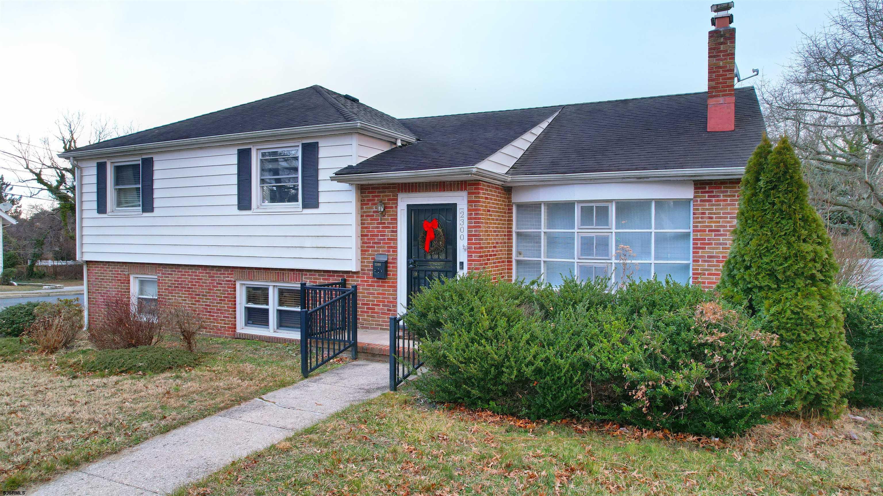 2300 Shore Road Linwood, NJ 08221 - Photo 25 of 50 a front view of a house with garden