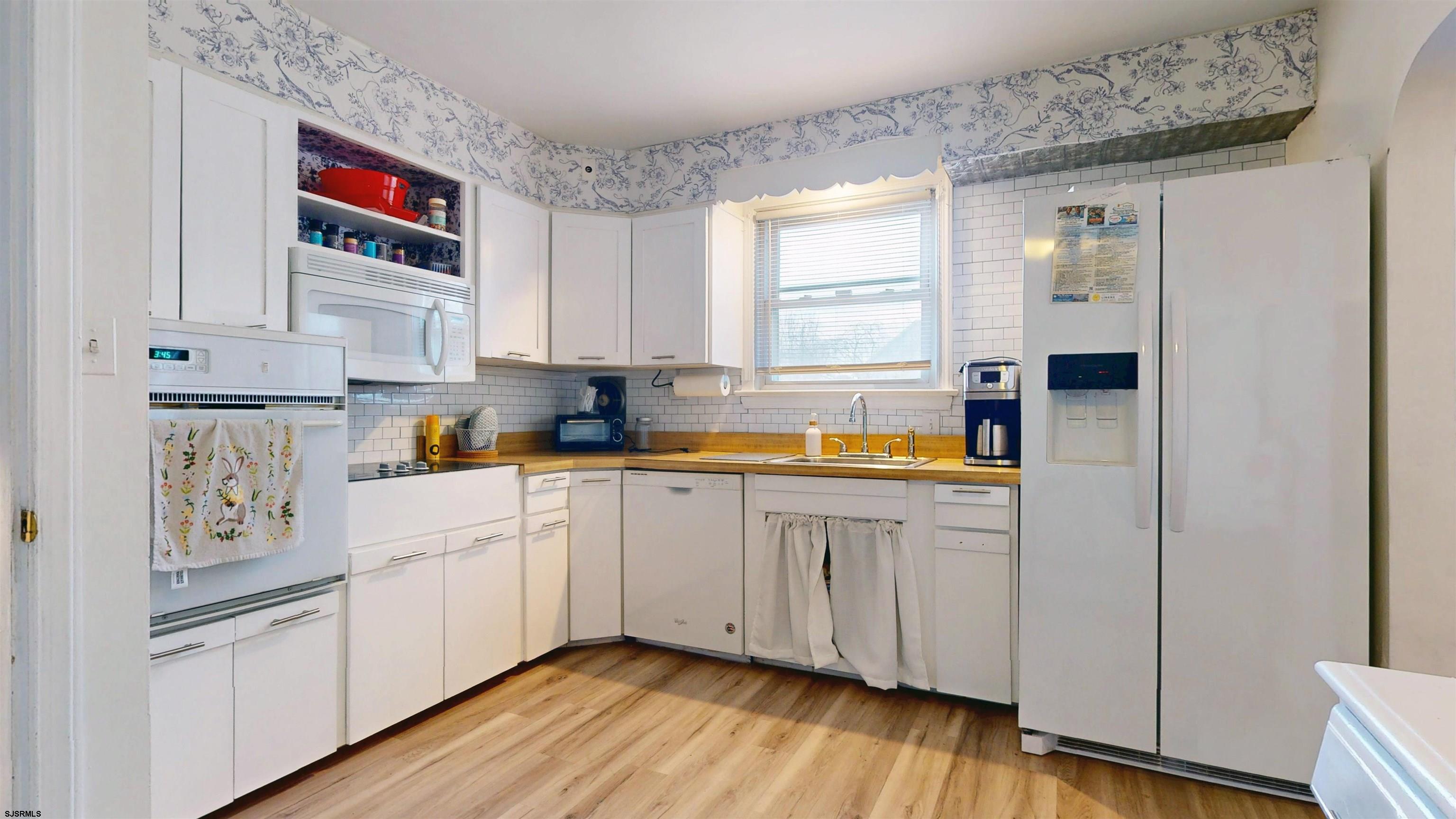 2300 Shore Road Linwood, NJ 08221 - Photo 28 of 50 a kitchen with stainless steel appliances granite countertop a refrigerator and a stove top oven