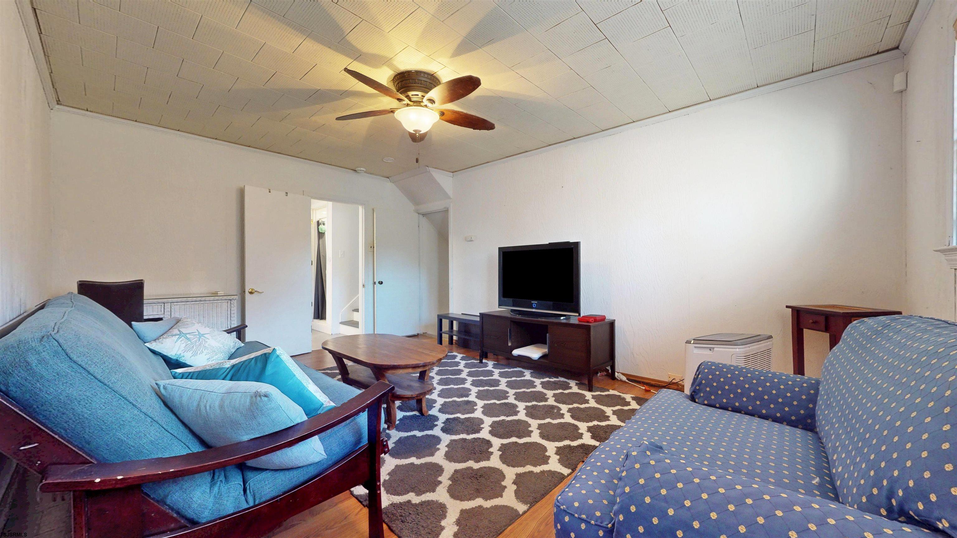 2300 Shore Road Linwood, NJ 08221 - Photo 33 of 50 a living room with furniture and a flat screen tv