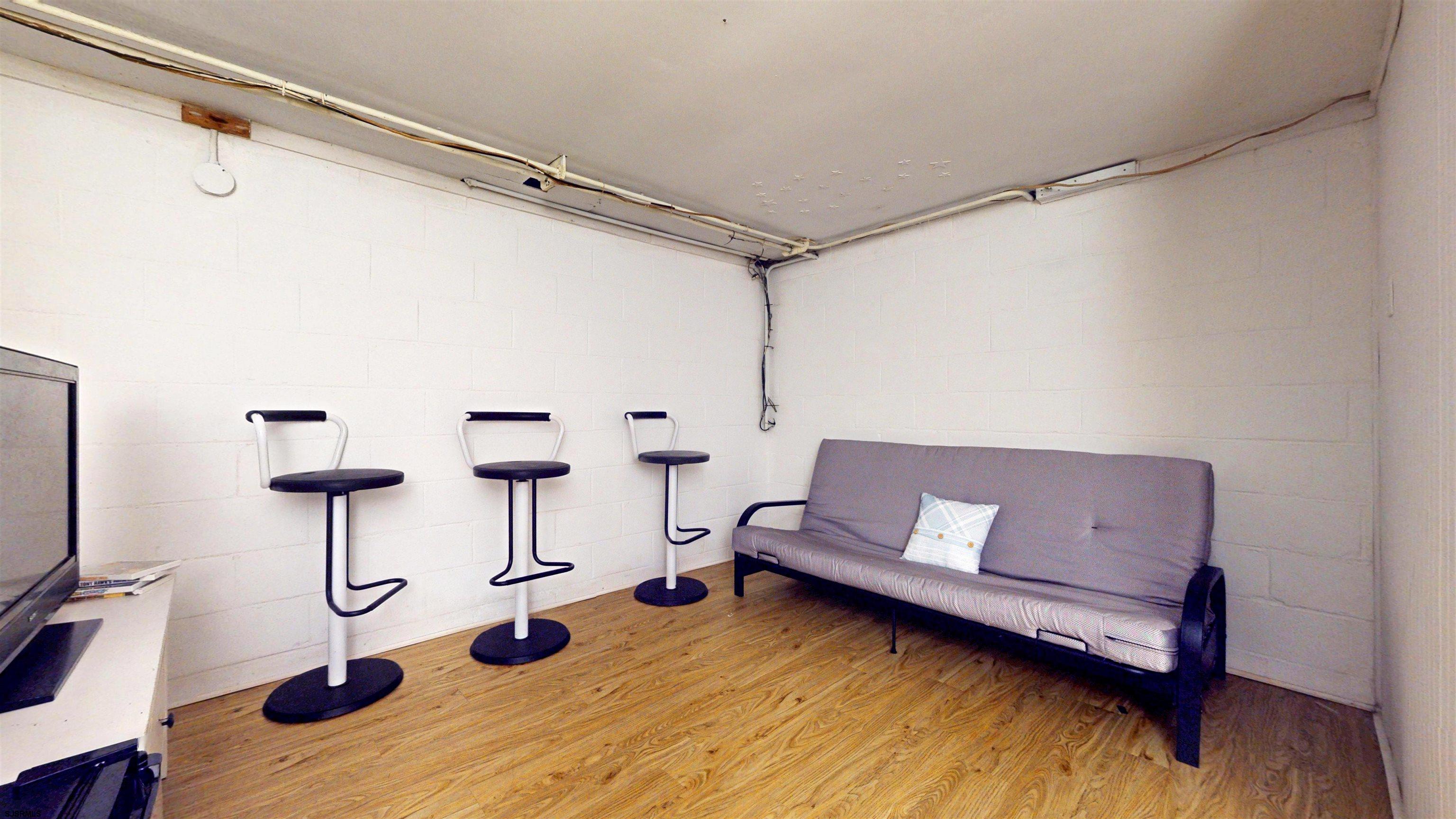 2300 Shore Road Linwood, NJ 08221 - Photo 35 of 50 a living room with furniture and a flat screen tv