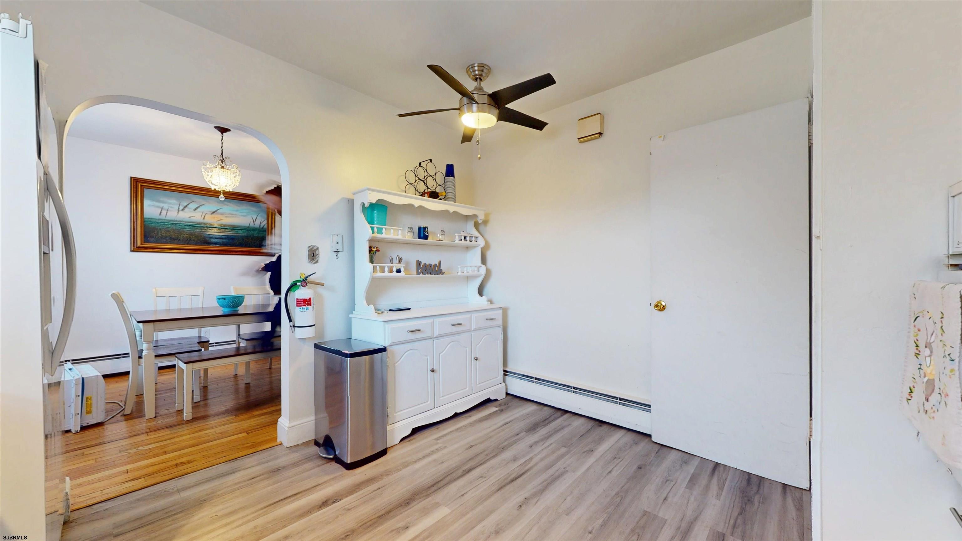 2300 Shore Road Linwood, NJ 08221 - Photo 36 of 50 a workspace with wooden floor and ceiling fan