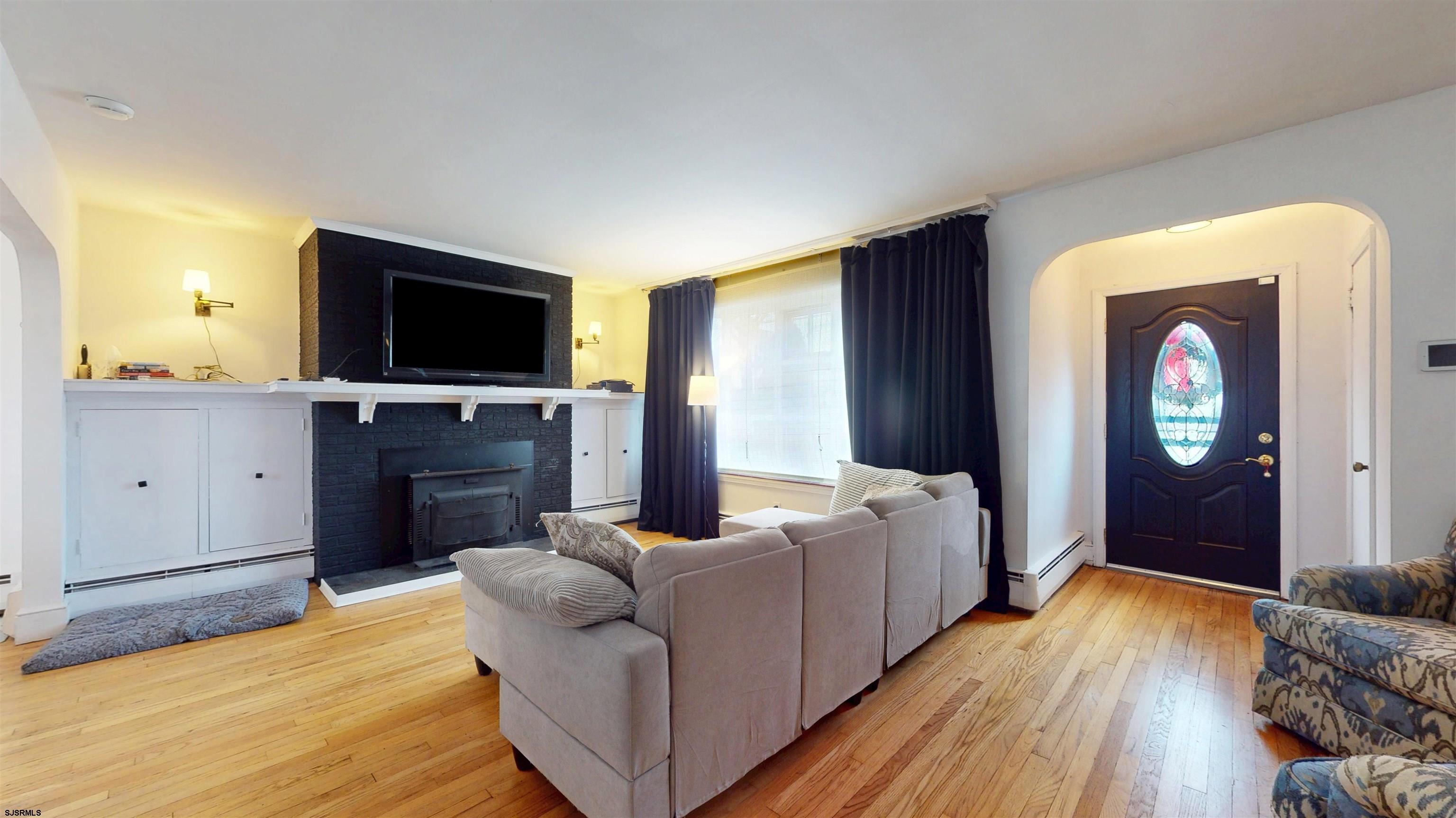 2300 Shore Road Linwood, NJ 08221 - Photo 37 of 50 a living room with furniture and a flat screen tv