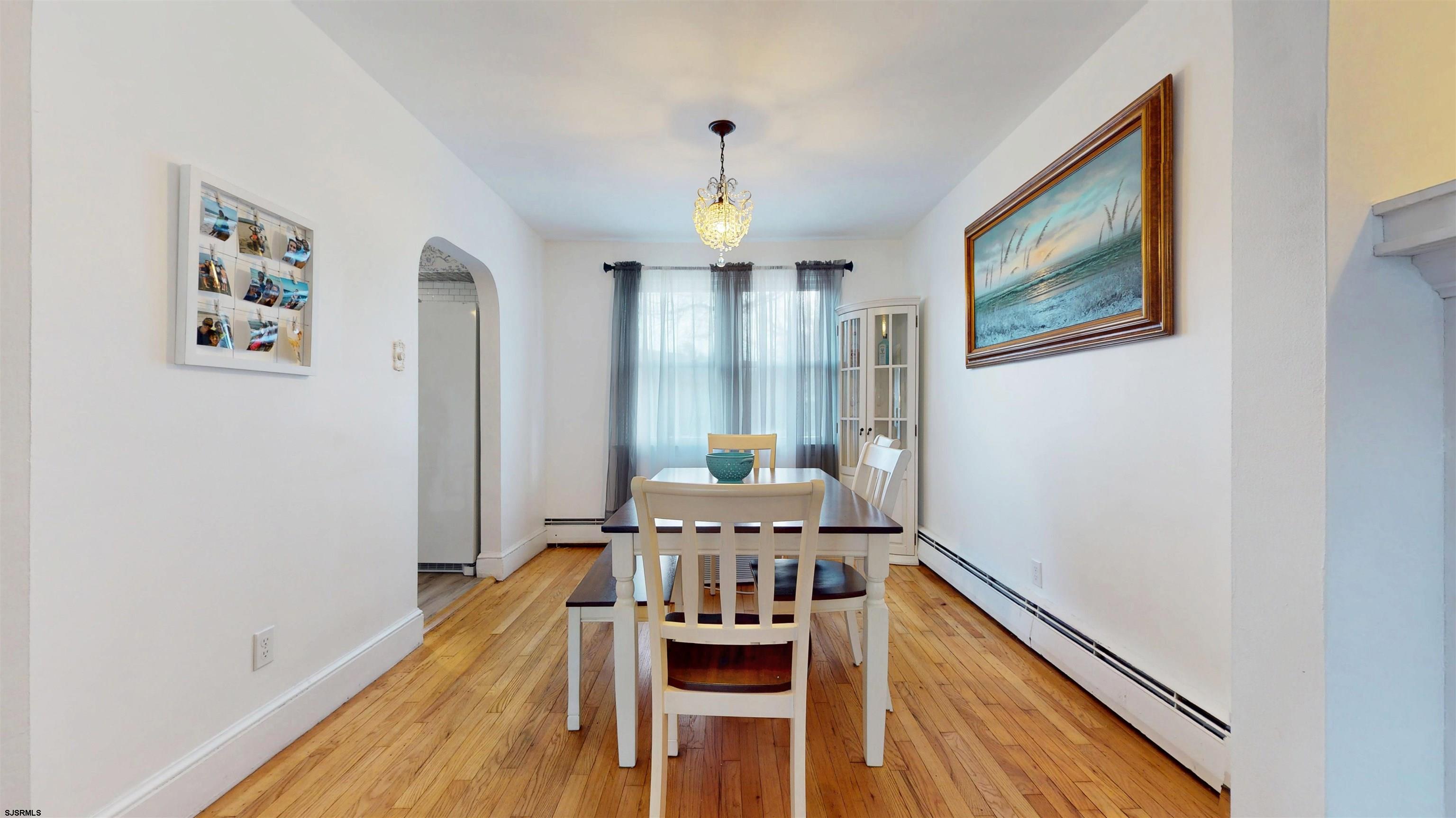 2300 Shore Road Linwood, NJ 08221 - Photo 38 of 50 a view of a dining room with furniture window and wooden floor
