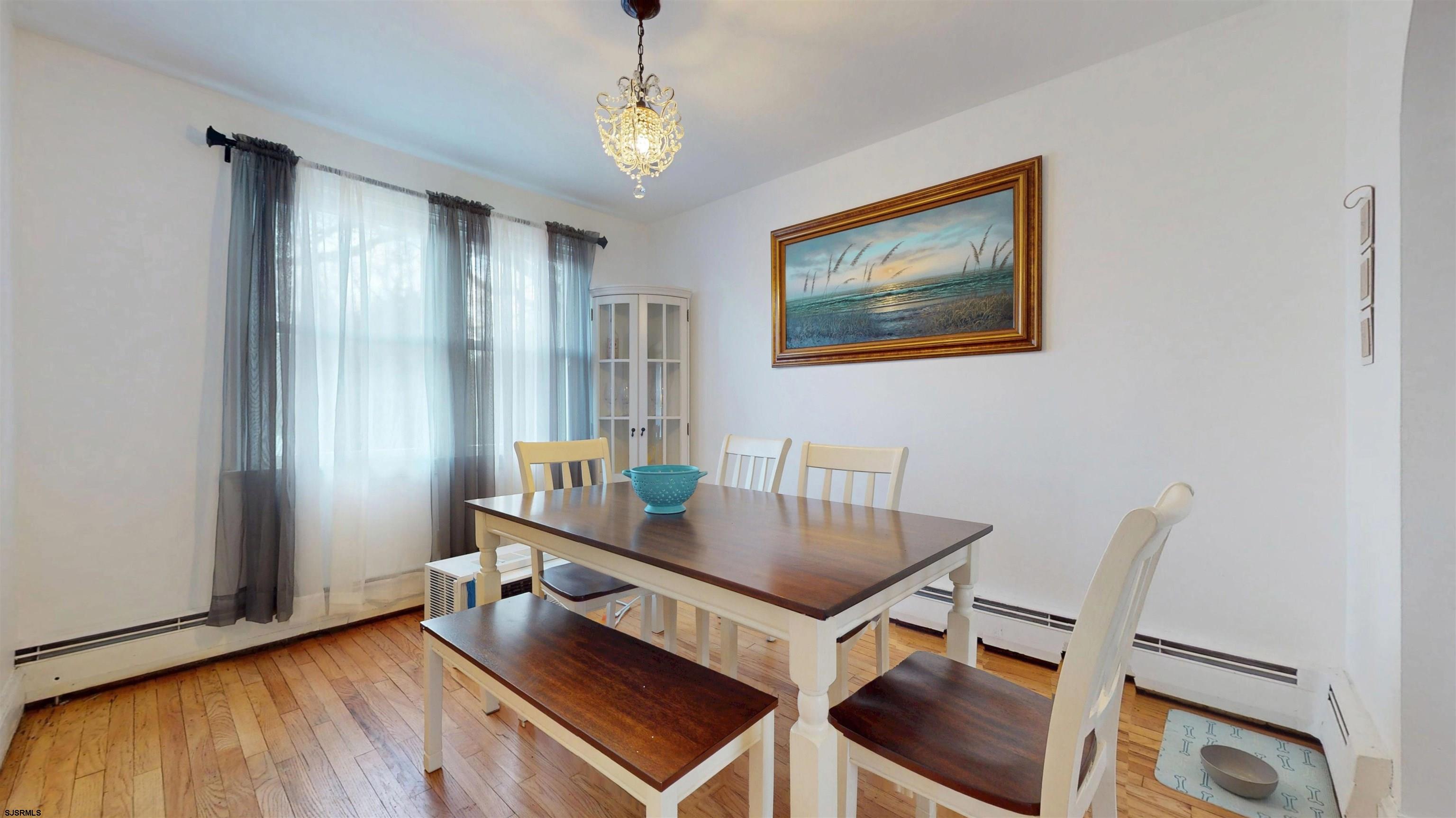 2300 Shore Road Linwood, NJ 08221 - Photo 39 of 50 a view of a dining room with furniture window and wooden floor