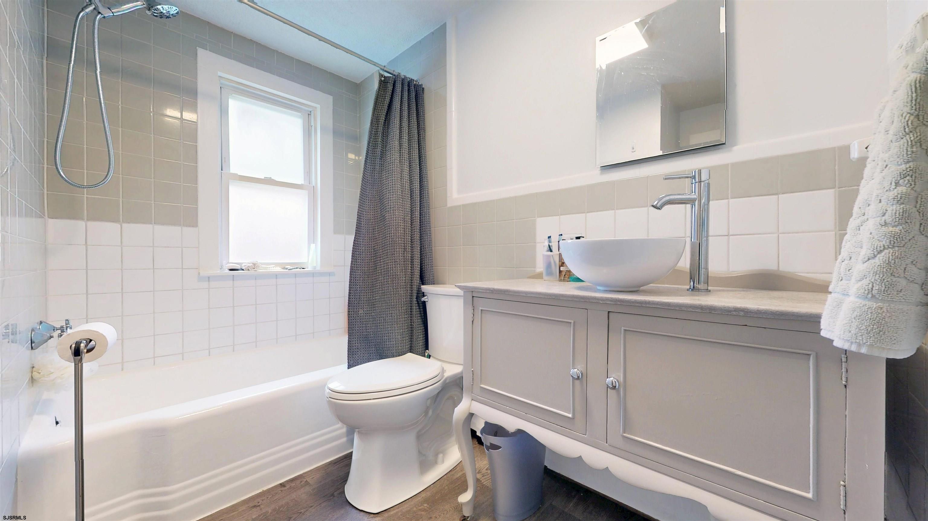 2300 Shore Road Linwood, NJ 08221 - Photo 40 of 50 a bathroom with a sink a toilet and bathtub