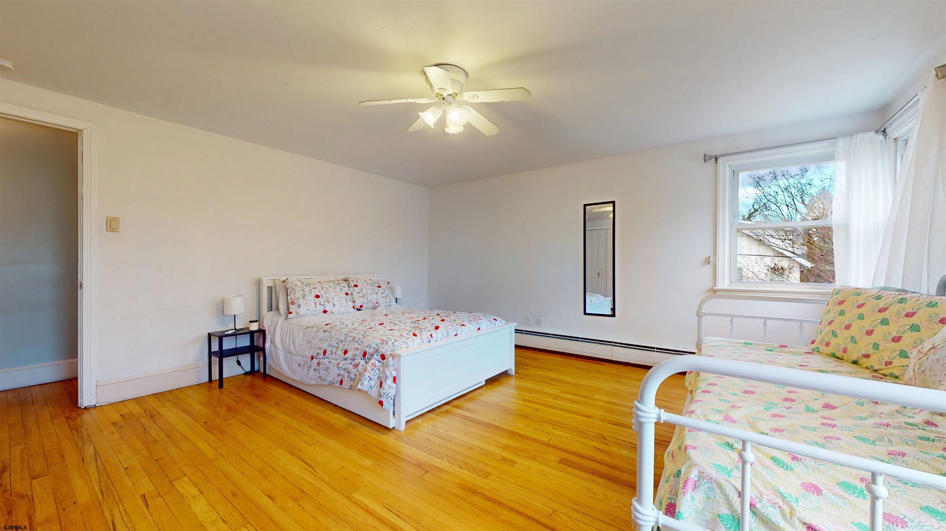 2300 Shore Road Linwood, NJ 08221 - Photo 45 of 50 a bedroom with a bed and window