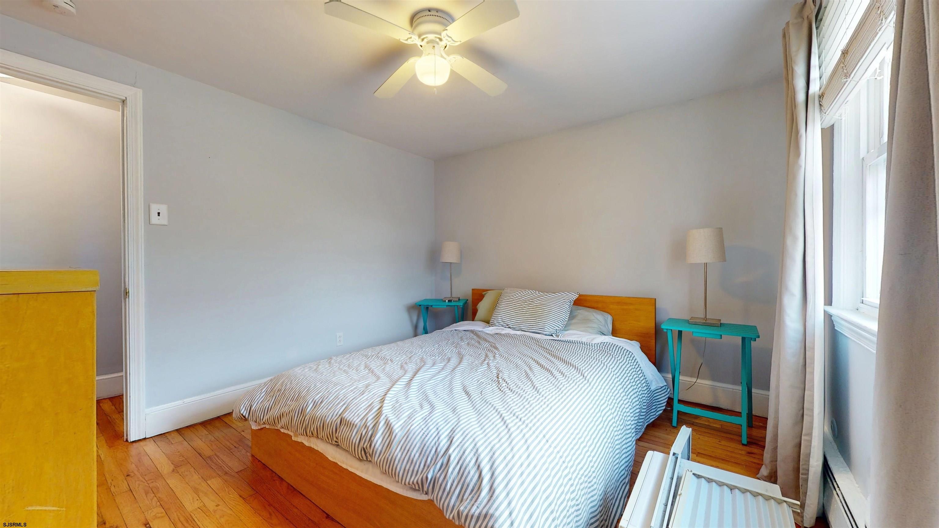 2300 Shore Road Linwood, NJ 08221 - Photo 7 of 50 a bedroom with a bed and a window