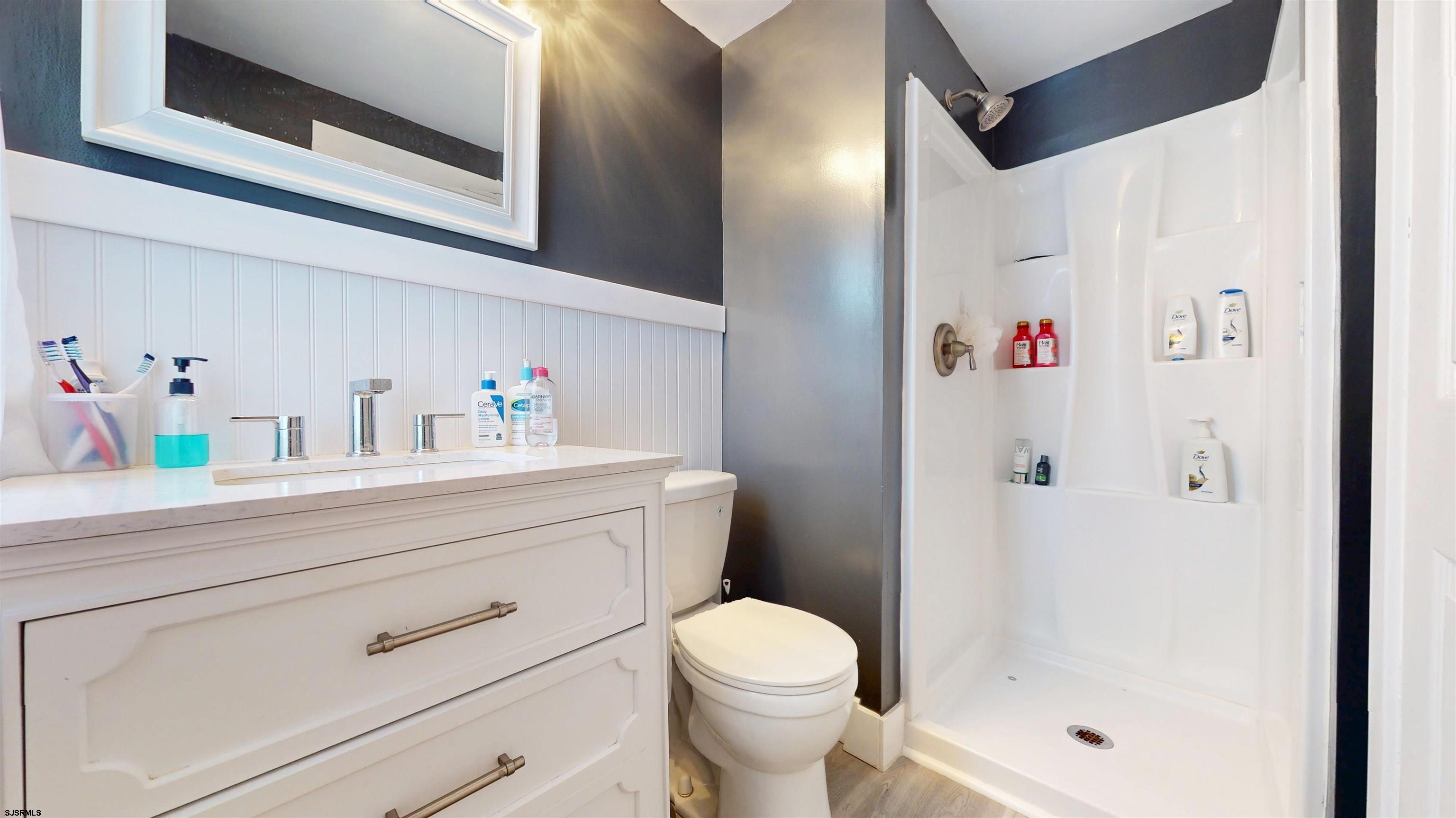 2300 Shore Road Linwood, NJ 08221 - Photo 8 of 50 a bathroom with a sink vanity mirror and toilet